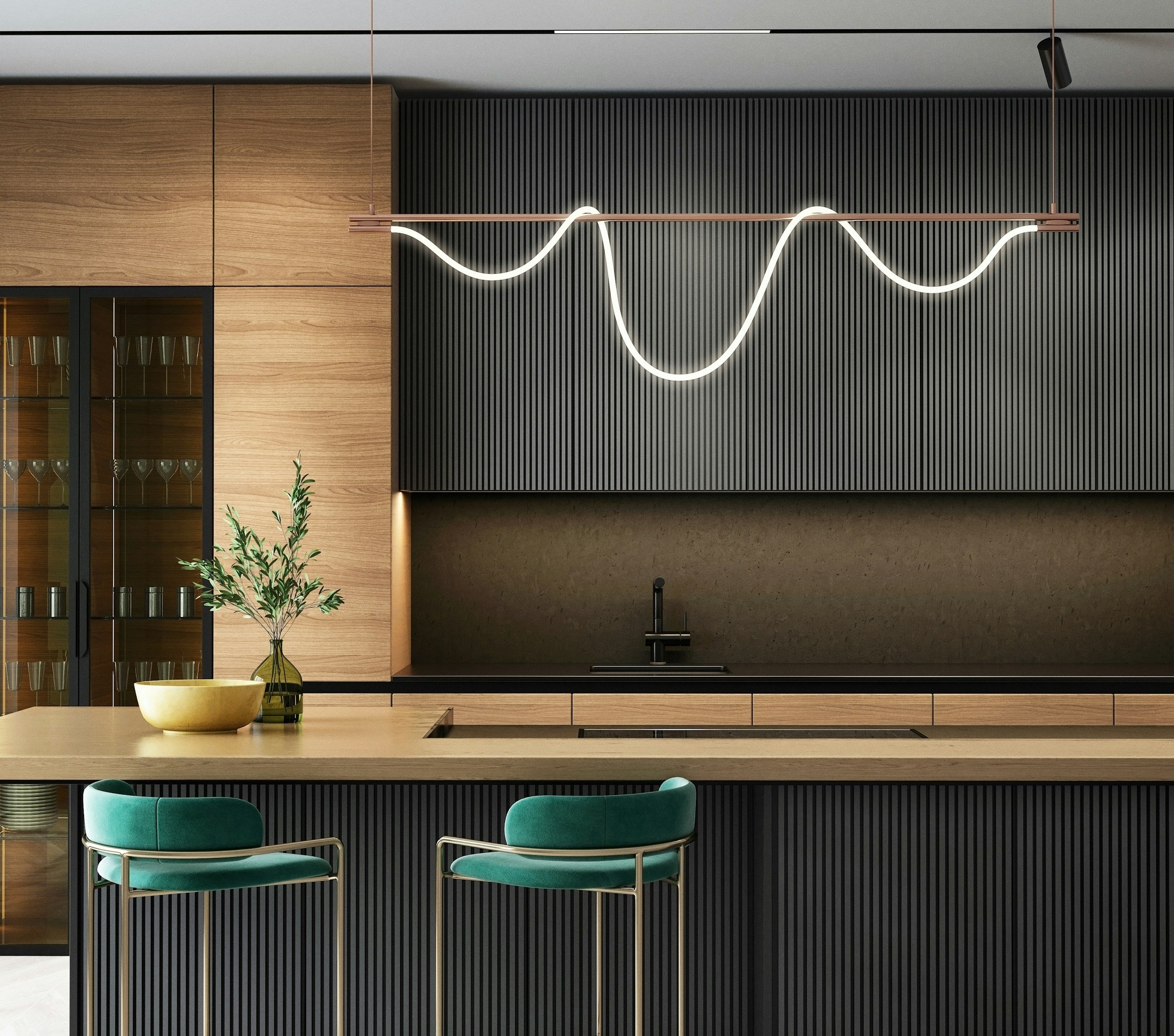 Modern kitchen interior with light wood cabinetry, black ribbed backsplash, and a beige countertop. Two teal bar stools with metal frames are at the island, which has a decorative vase with greenery and a yellow bowl. An artistic wave-shaped hanging