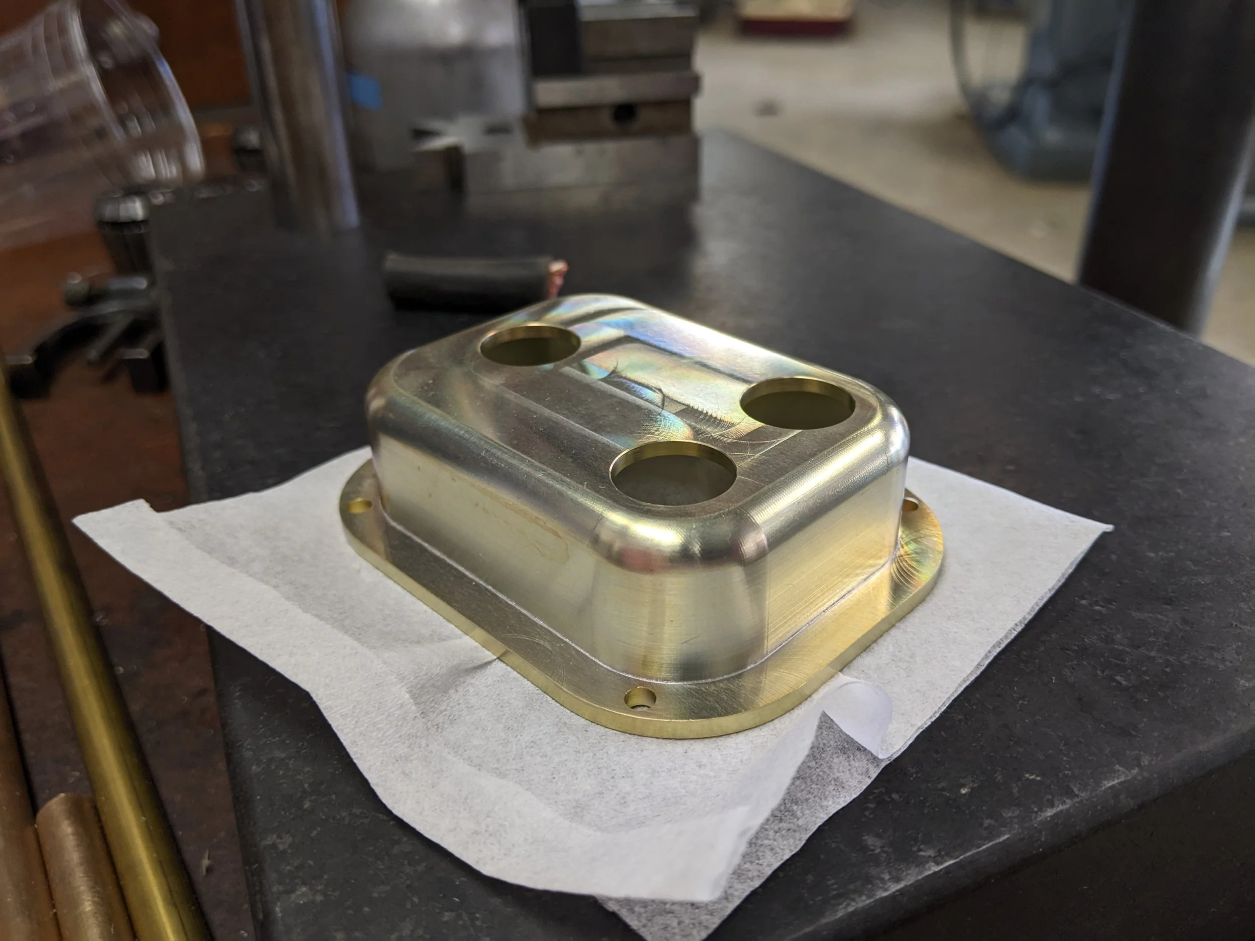 A protective cover to shield connectors from the weather, chromated aluminum.