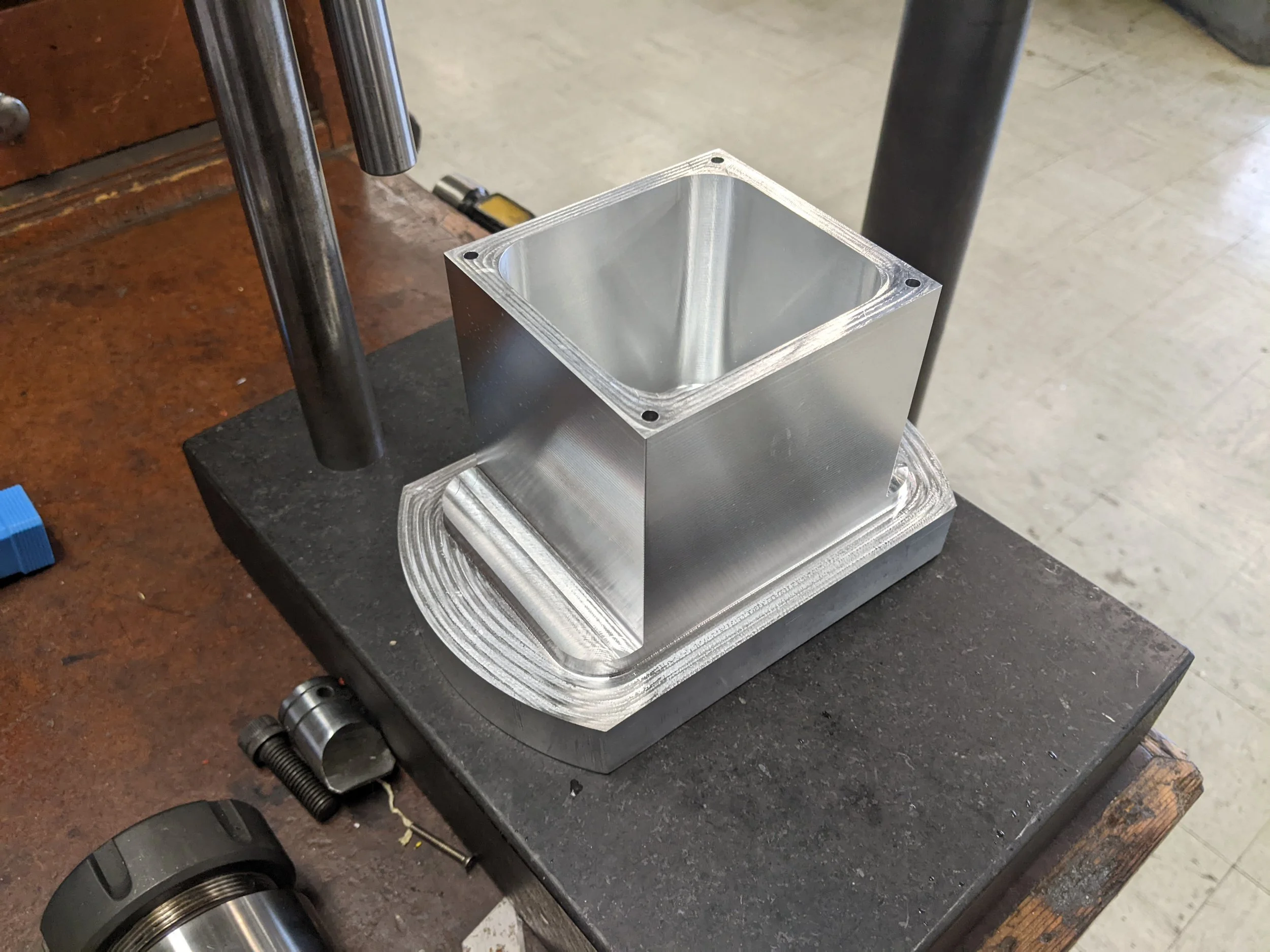 An aluminum box machined from one solid block.