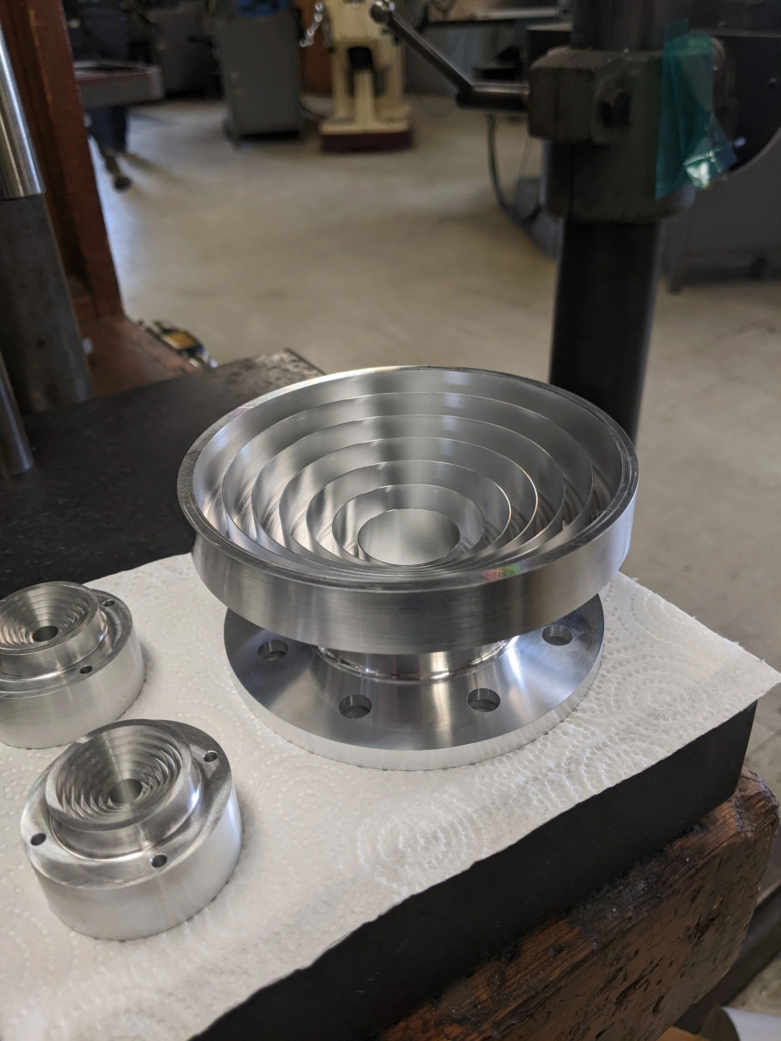 A large and small RF feed horn, aluminum.