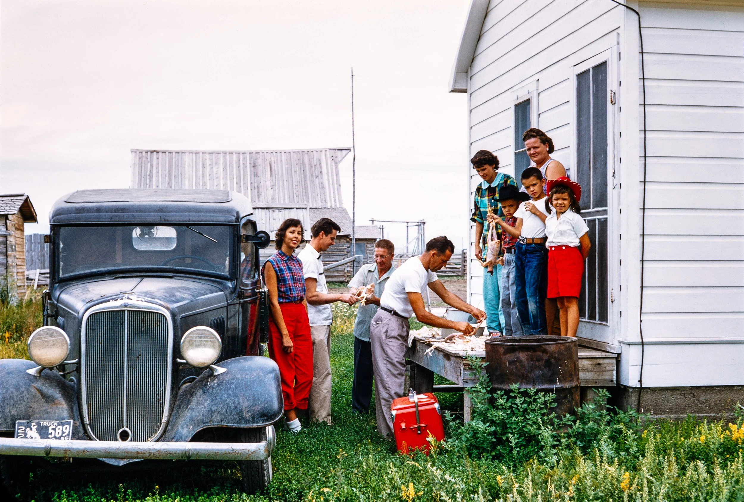 JH_010: Mormon Row, Chickens; Bettye Arvin, Orson Arvin, Beckham, Benny Kelly, Mary Kelly, Patrick Kelly, Michael Kelly, Virgie, Katy Kelly (L to R) © Estate of Orson L. Arvin