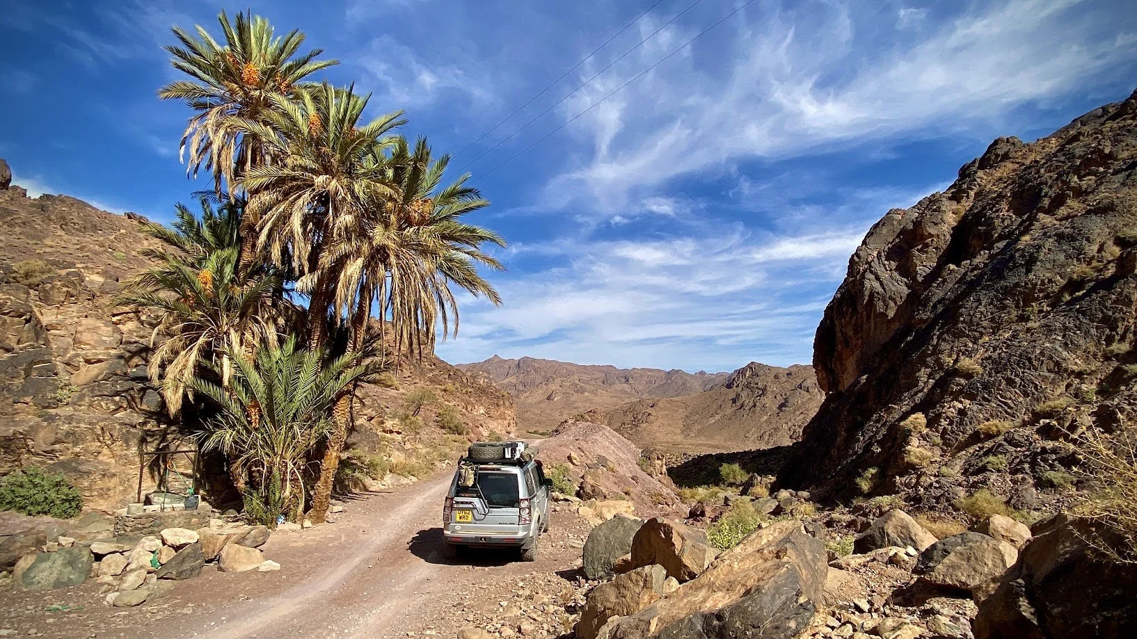 Discovery 4 driving through mountain pass to another adventure