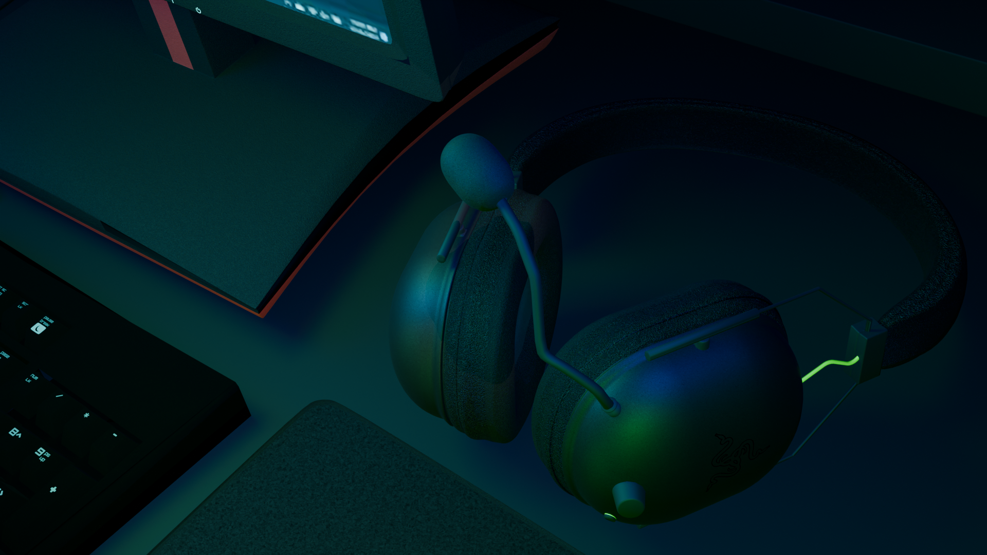 Close-up of a gaming setup with a computer monitor, a keyboard, and a pair of headphones placed on a desk, illuminated by ambient lighting.