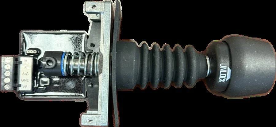 A mechanical ignition switch with a black rubber boot and metal components.