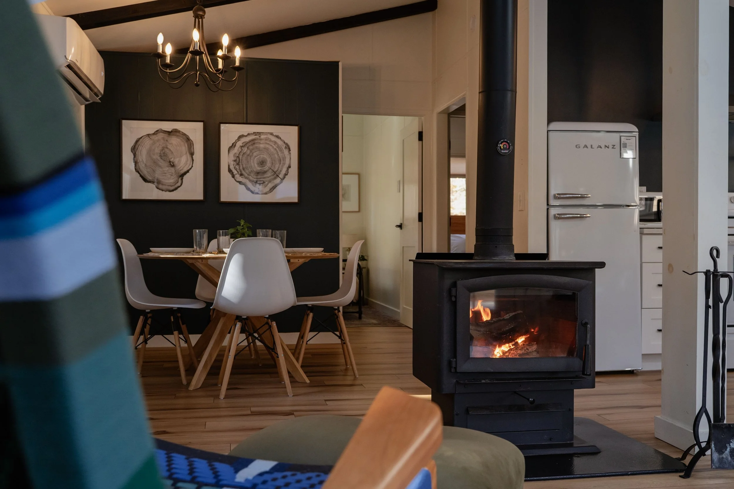 A cozy view from the handmade rocking chair in the living room overlooking the wood stove.