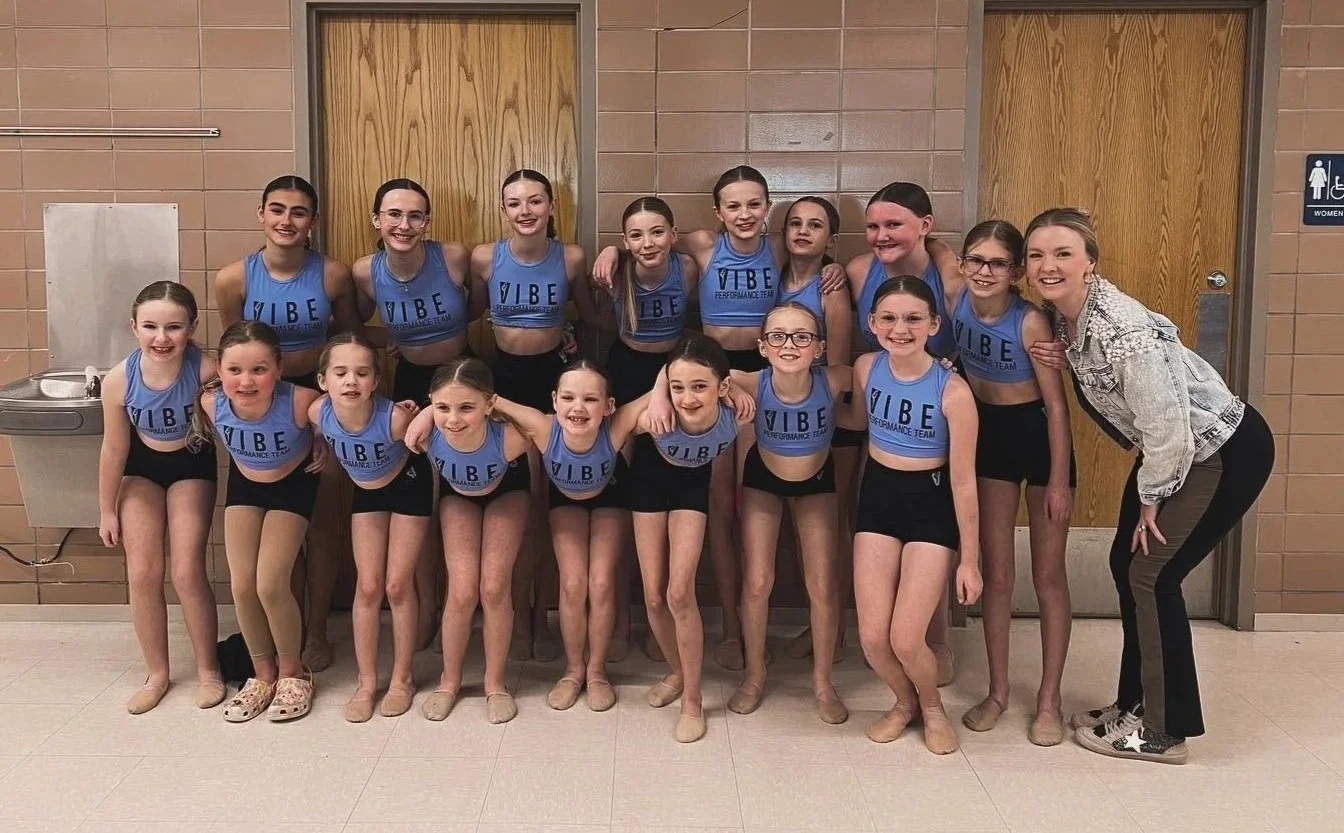 Performance Team in purple Vibe tops. Shown with Mallory Weber of Dubuque, Iowa.