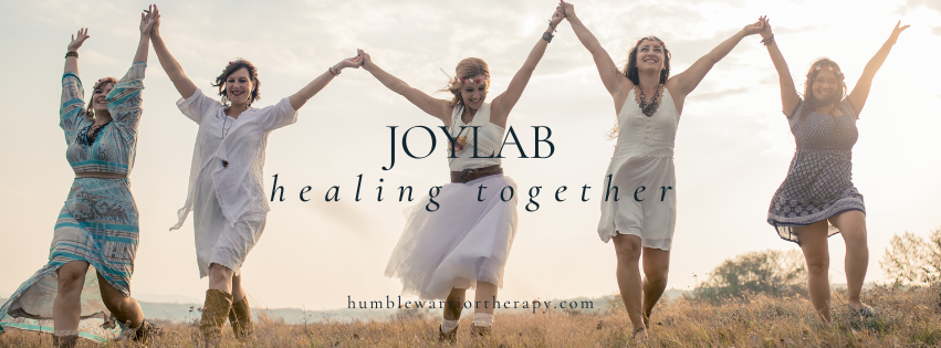 people holding hands together in joyful celebration symbolizing healing and community connection