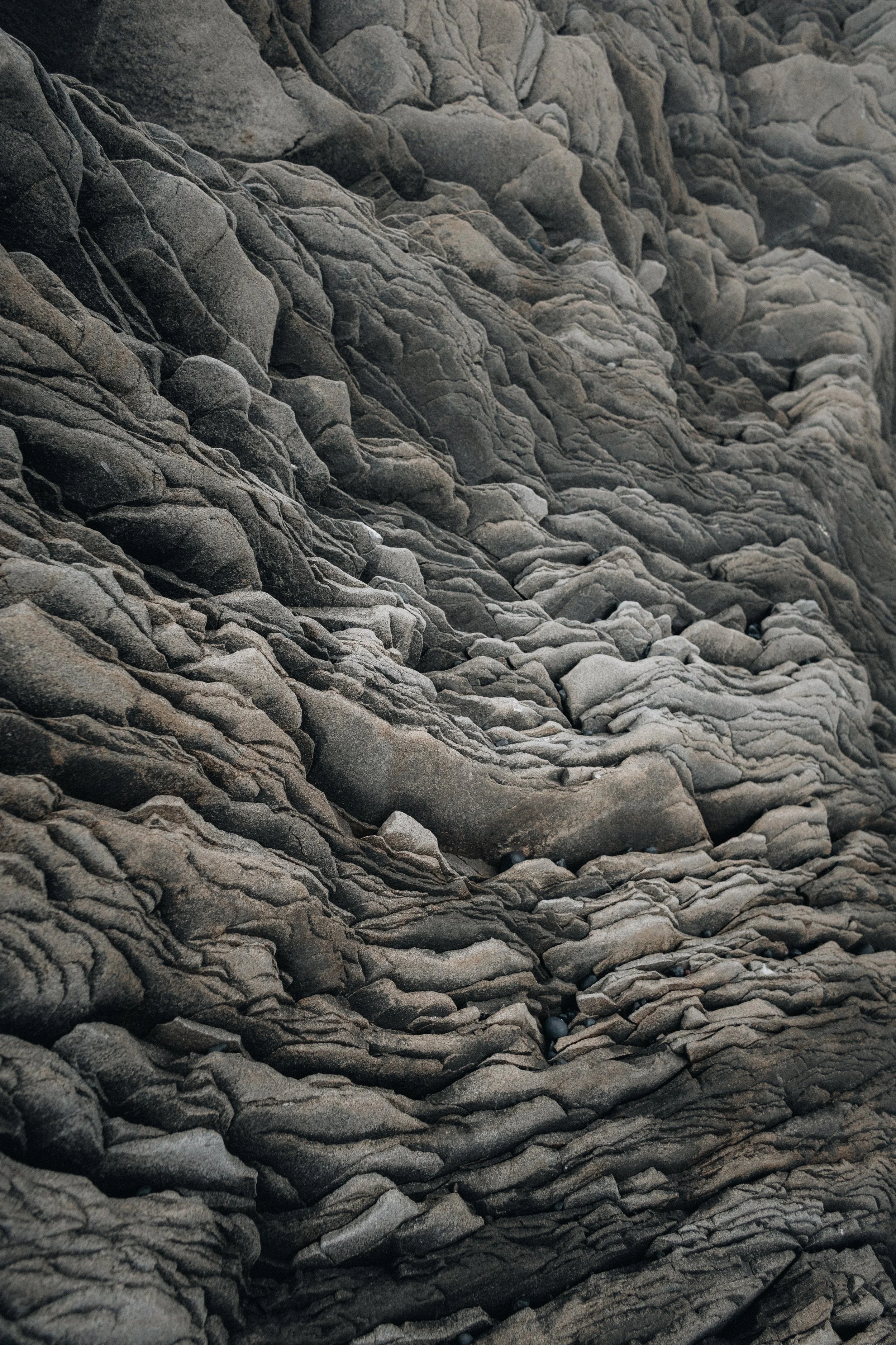 Close-up of layered, textured gray rock formations.