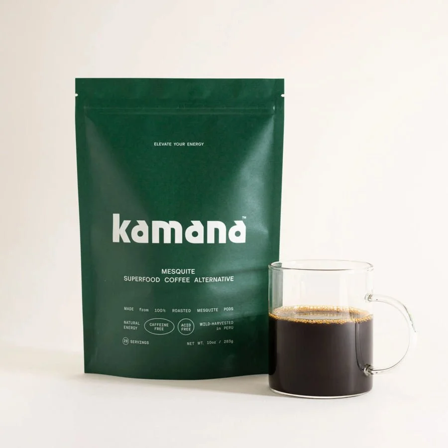 A green bag of Kamana Mesquite Superfood Coffee Alternative next to a clear glass mug filled with black coffee.