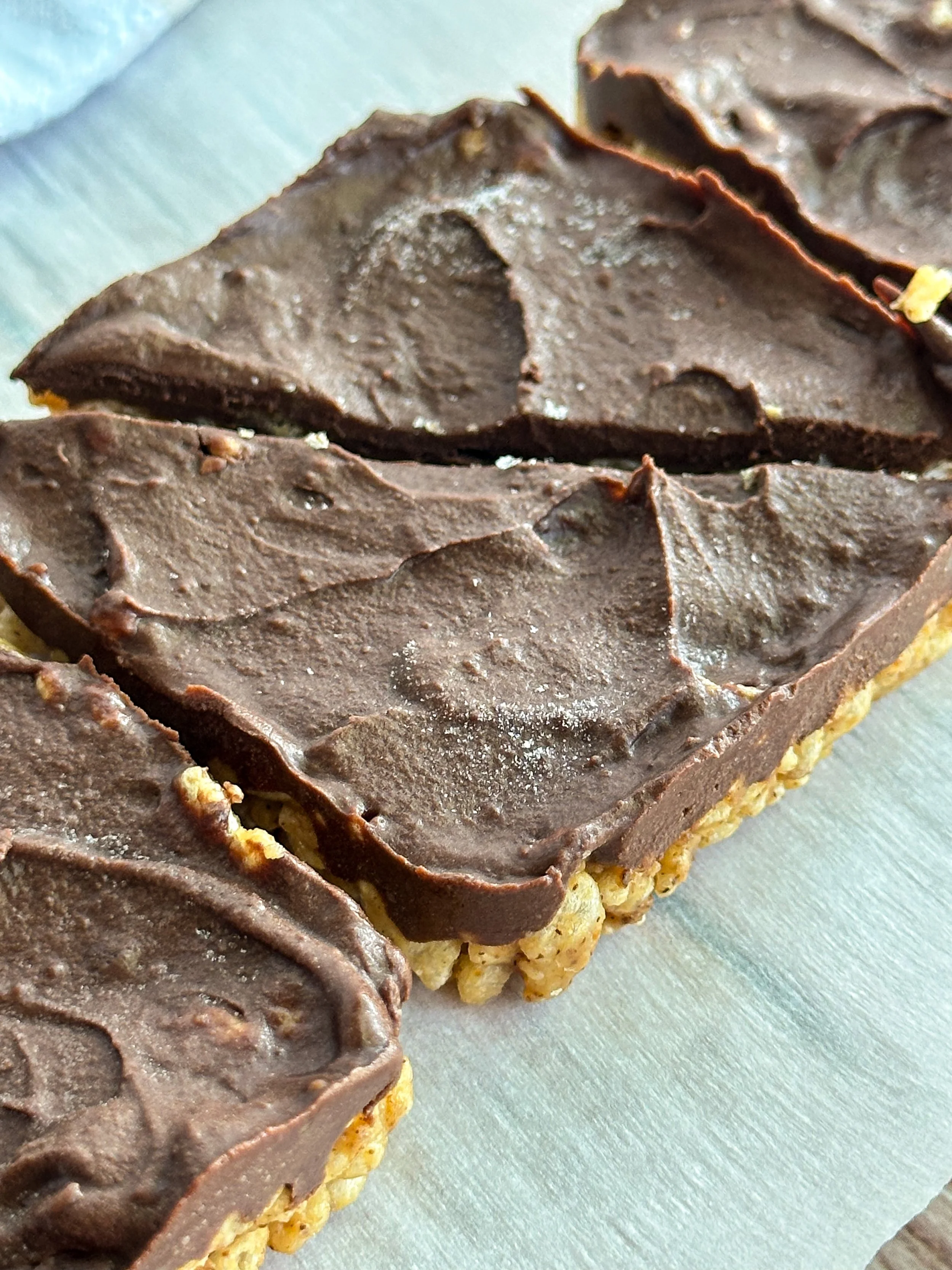 Fudge crispie squares on parchment paper, perfect for gut-friendly dessert
