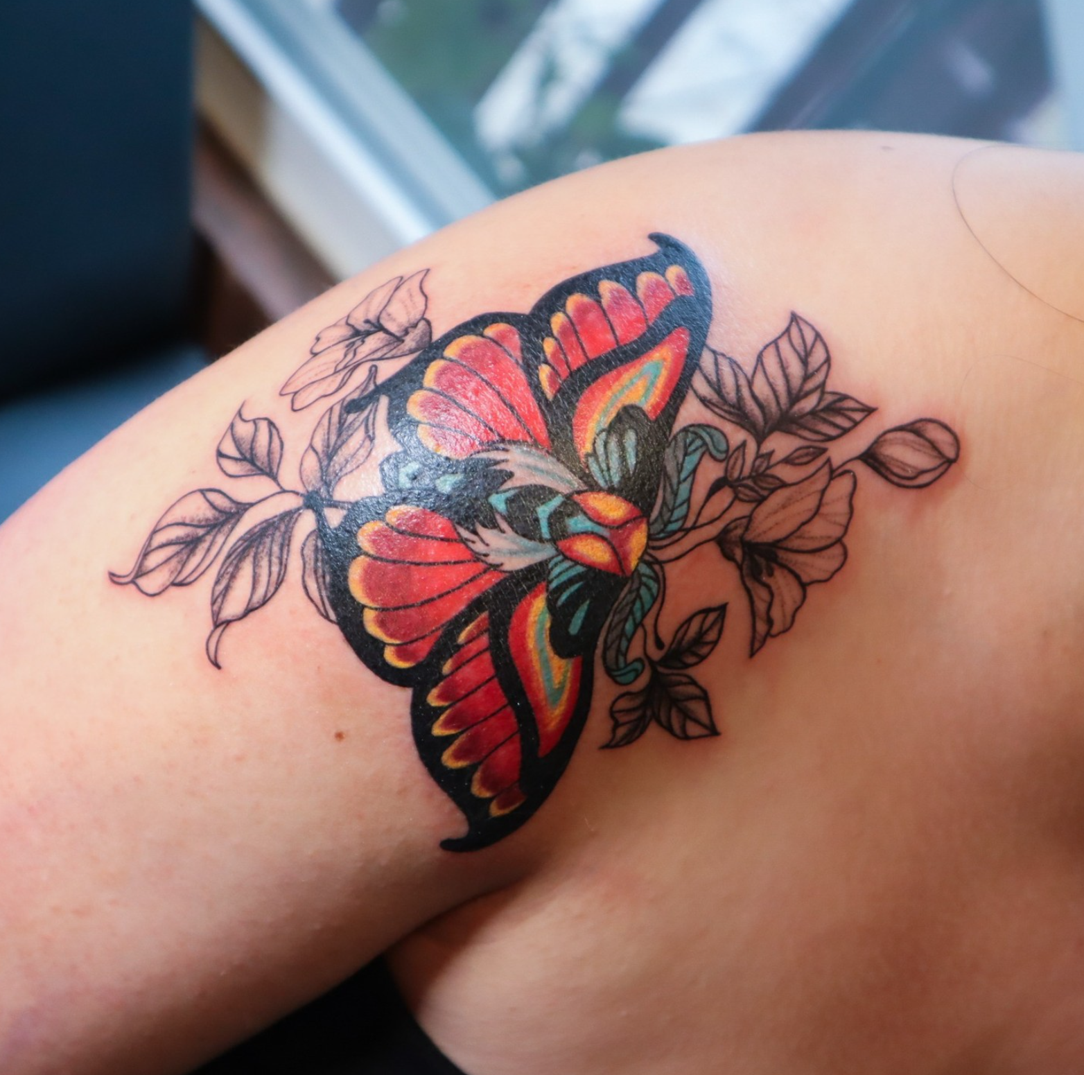 Lunar Moth and Flowers tattoo by tattoo artist Willow Thomason located in Wolfville, Nova Scotia