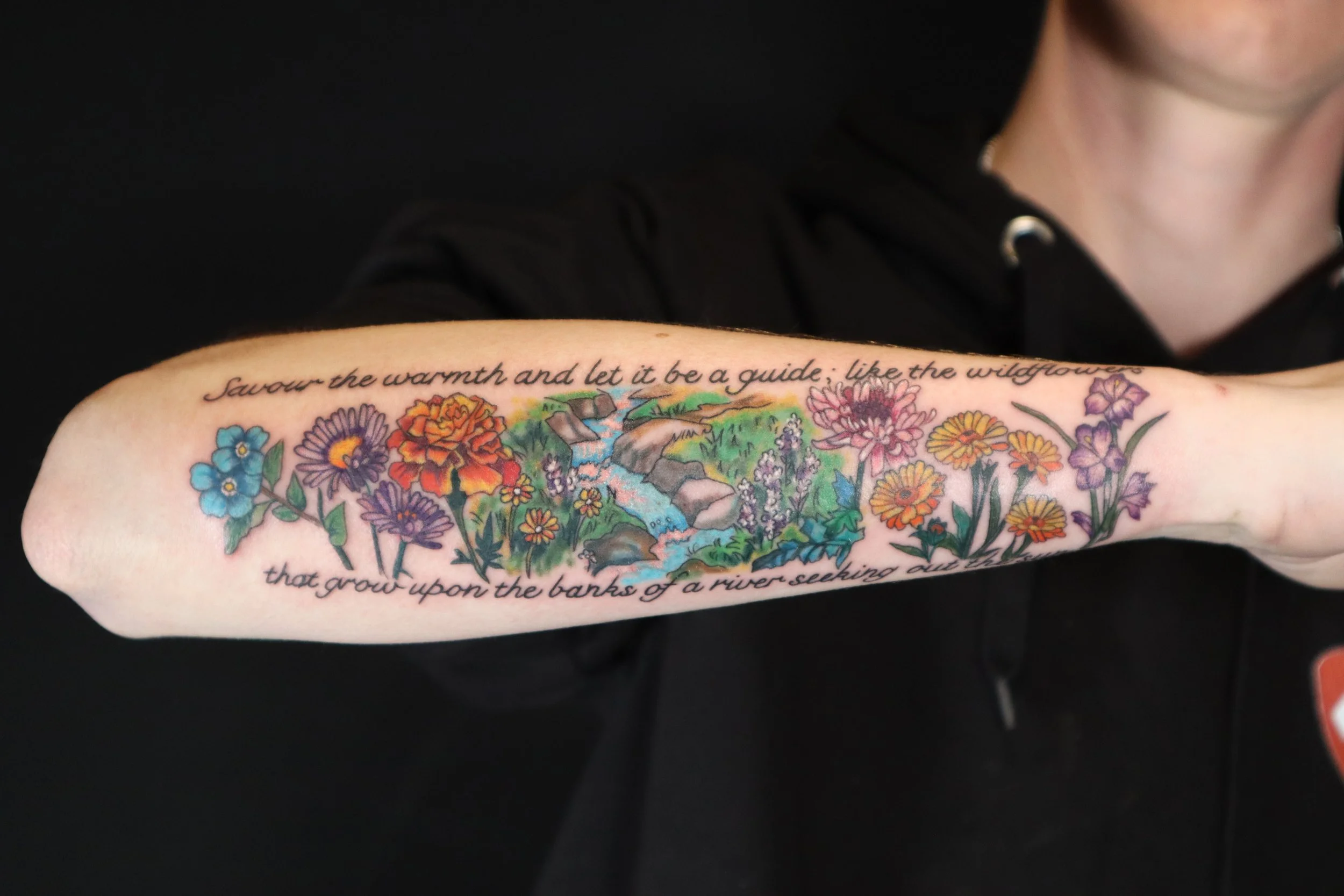 Flowers script river tattoo arm by Willow Thomason in New Minas Wolfville Kentville