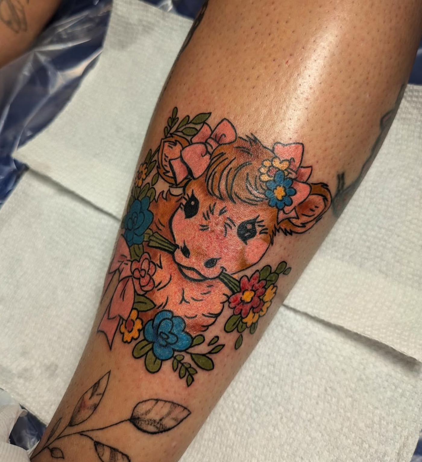 Highland Cow tattoo by tattoo artist Willow Thomason located in Wolfville, Nova Scotia