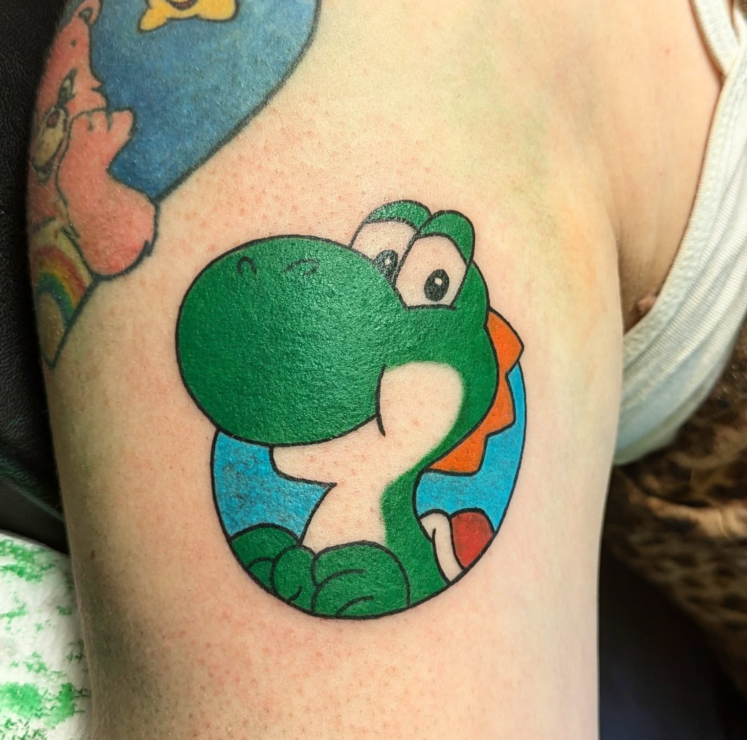 Yoshi tattoo by tattoo artist Willow Thomason located in Wolfville, Nova Scotia