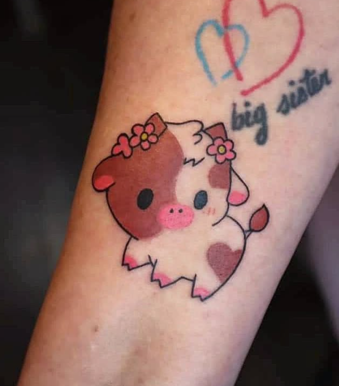 Cute Cow tattoo by tattoo artist Willow Thomason located in Wolfville, Nova Scotia