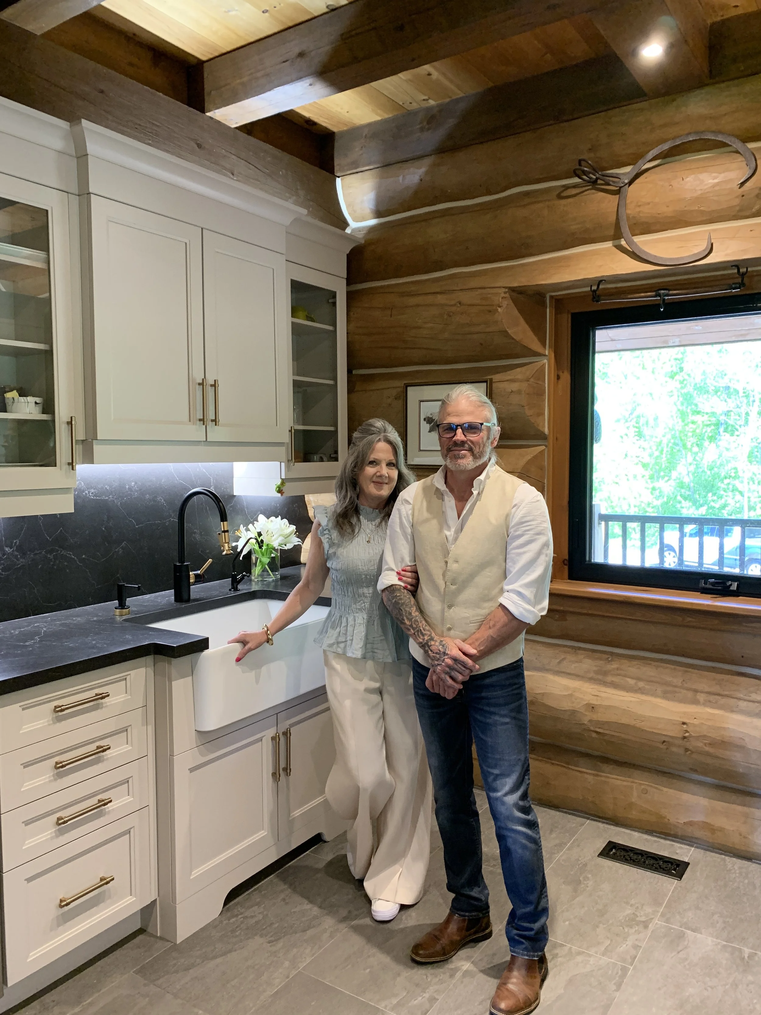 Todd and Sandra from Hardrock Home on site at a stunning putty kitchen renovation in a Queensville log home
