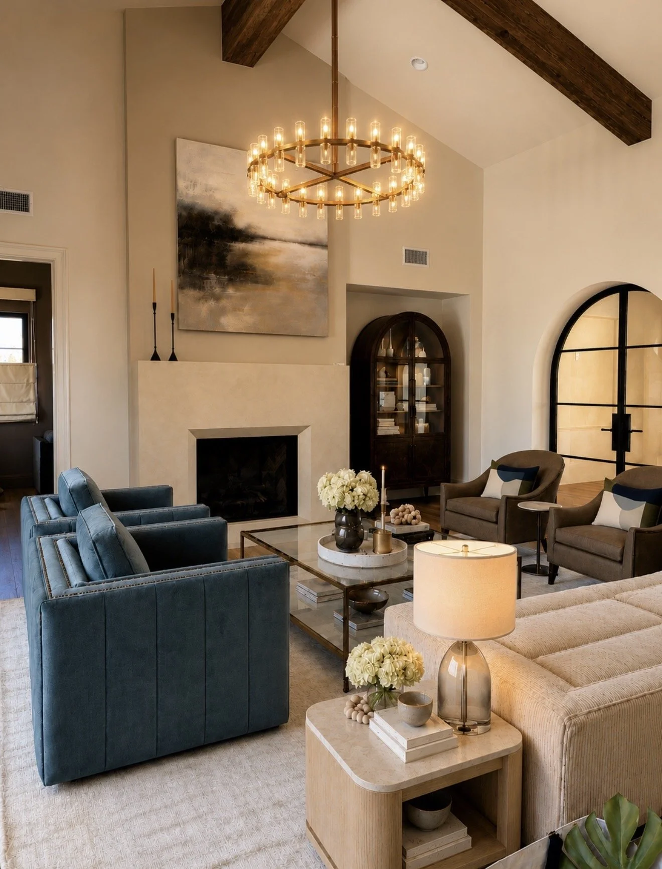 Warm contemporary living room with vaulted ceilings, custom furnishings and architectural details in a San Diego home.