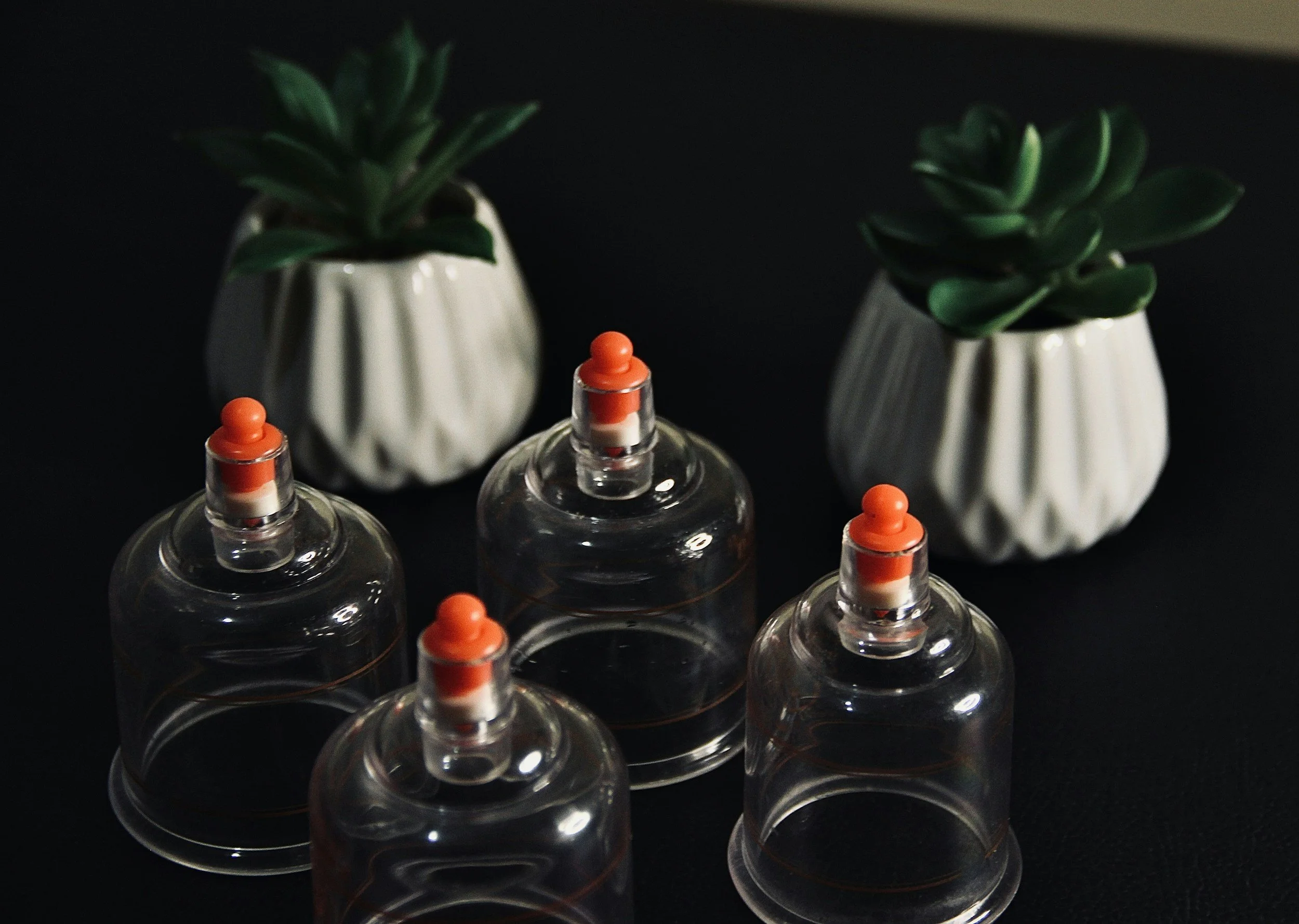 Traditional Chinese Medicine (TCM) facial cupping treatment for gentle facial massage and natural skin rejuvenation at Coastal Wellness Chiropractic & Acupuncture in New Smyrna Beach, FL.