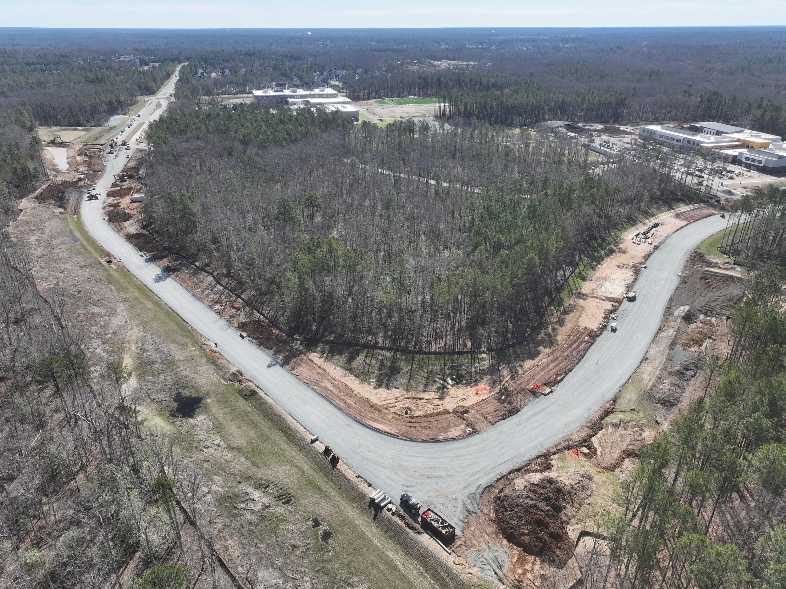 Pipe and bridge work continues. Subbase begins.