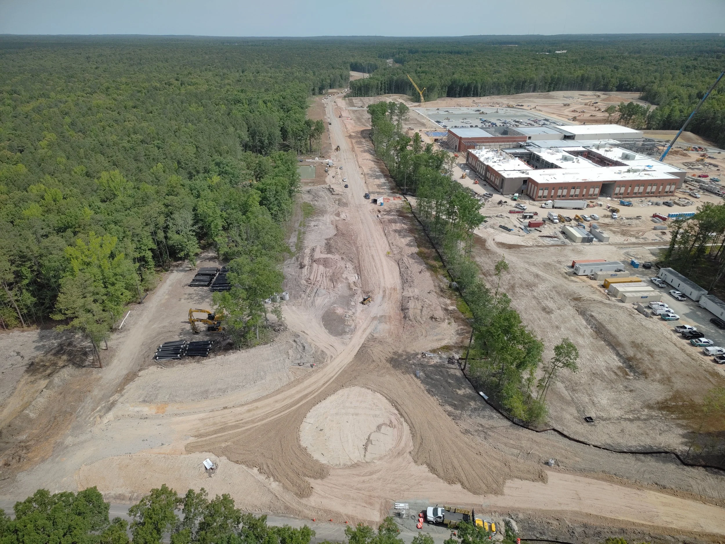 Waterline and roadway work continues. Bridge deck pour completed. Roundabout construction at Duval begins. 