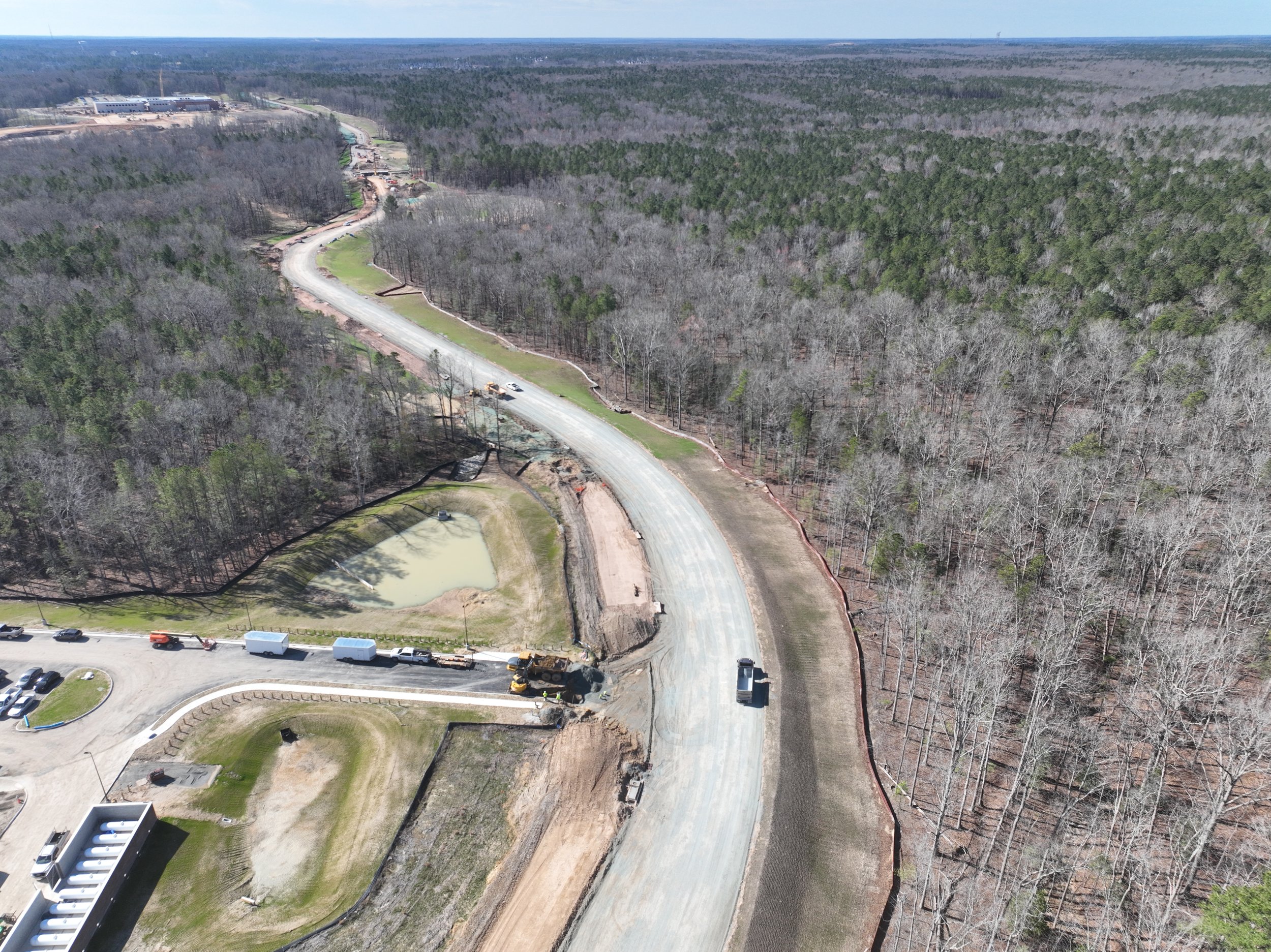 Pipe and bridge work continues. Subbase begins.
