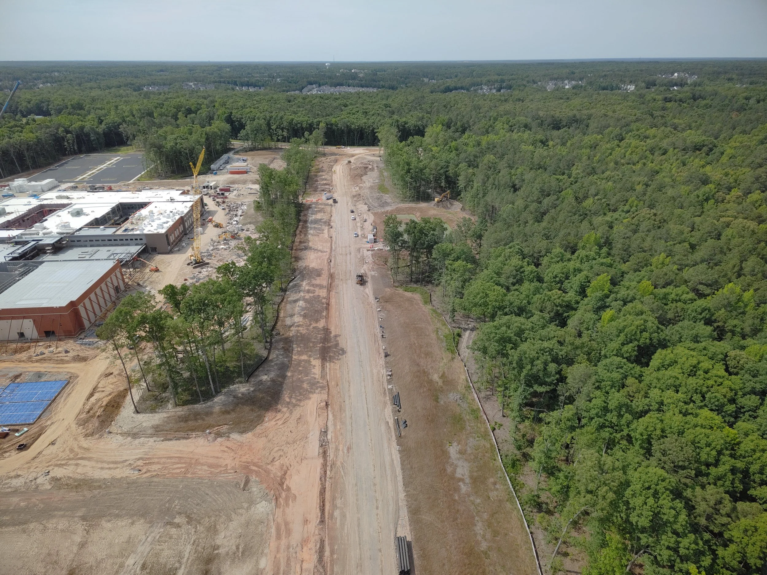Waterline and roadway work continues. Bridge deck pour completed. Roundabout construction at Duval begins. 