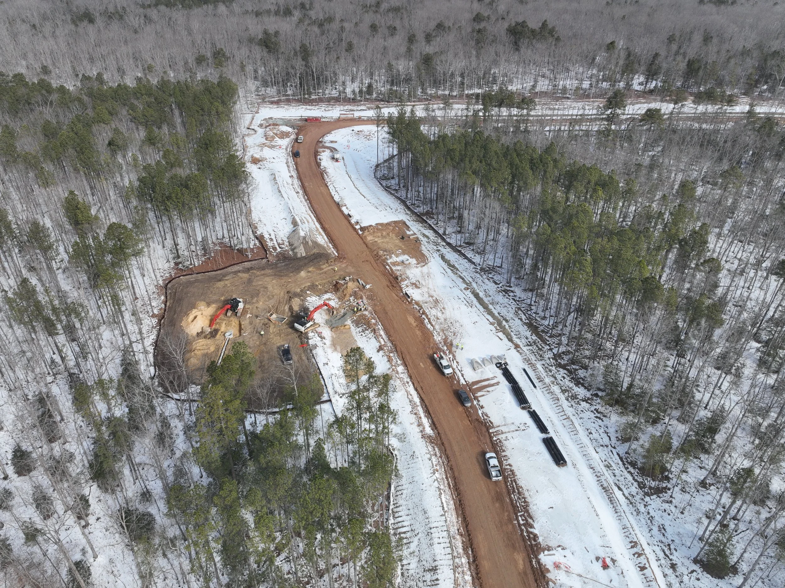 Roadway, pipe, and bridge work continues.