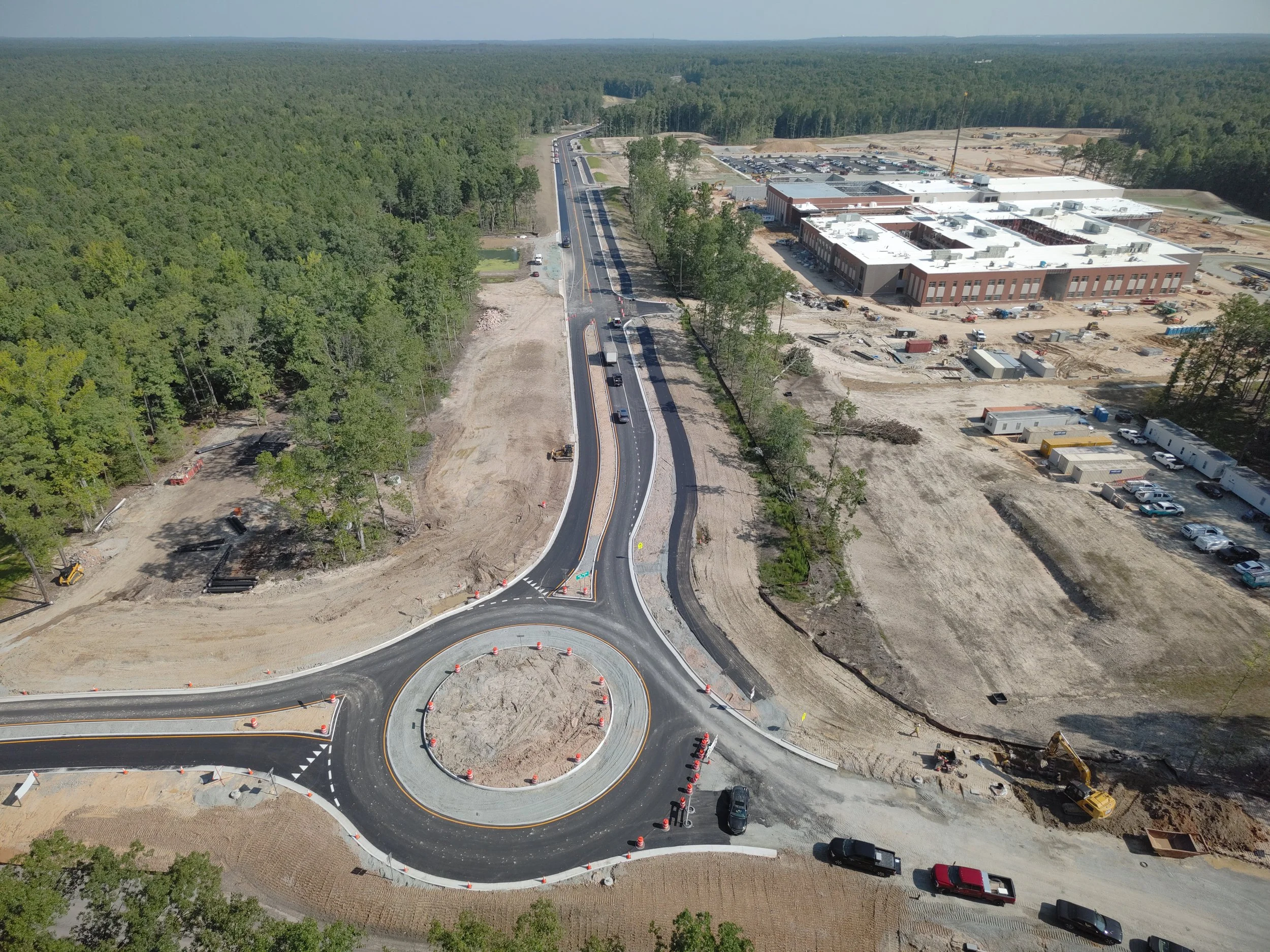John Thomas Way paving complete and open to two-way traffic. Roundabout construction continues. Duval road reconstruction begins.