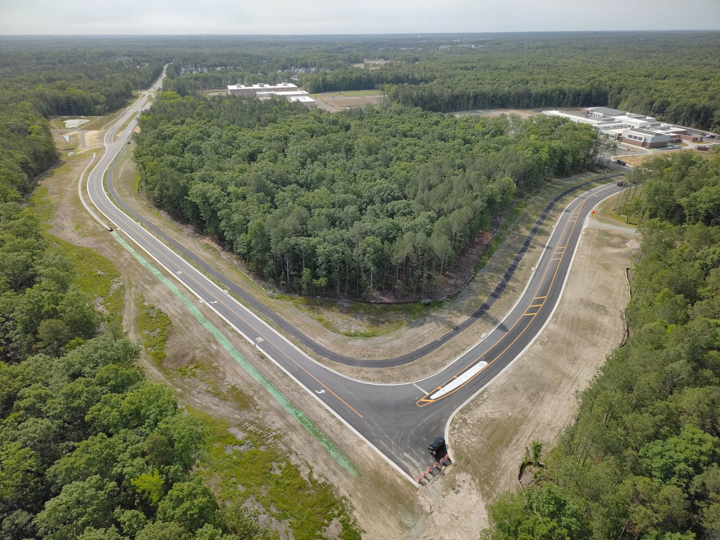 Waterline and roadway work continues. Bridge deck pour completed. Roundabout construction at Duval begins. 
