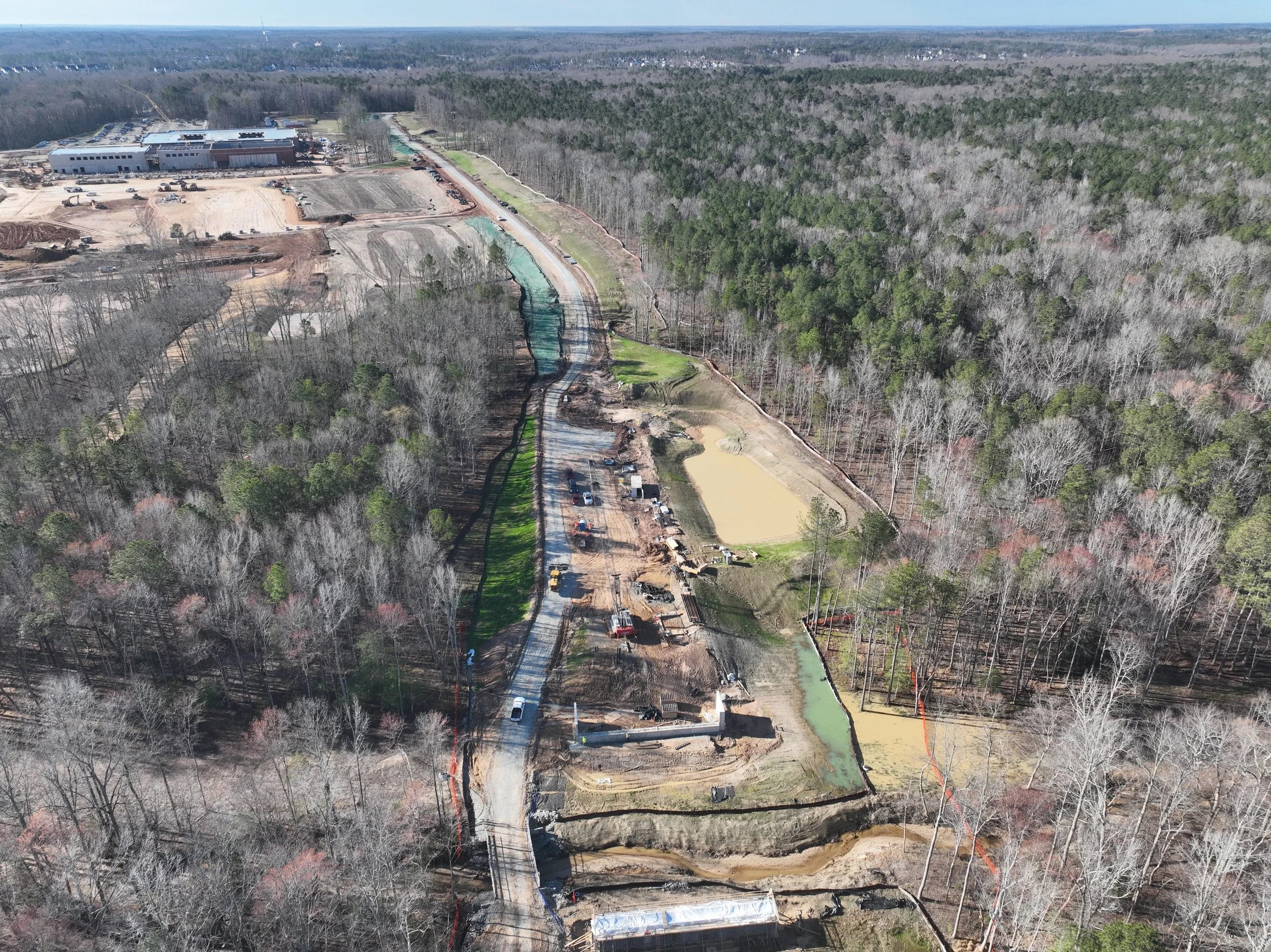 Pipe and bridge work continues. Subbase begins.