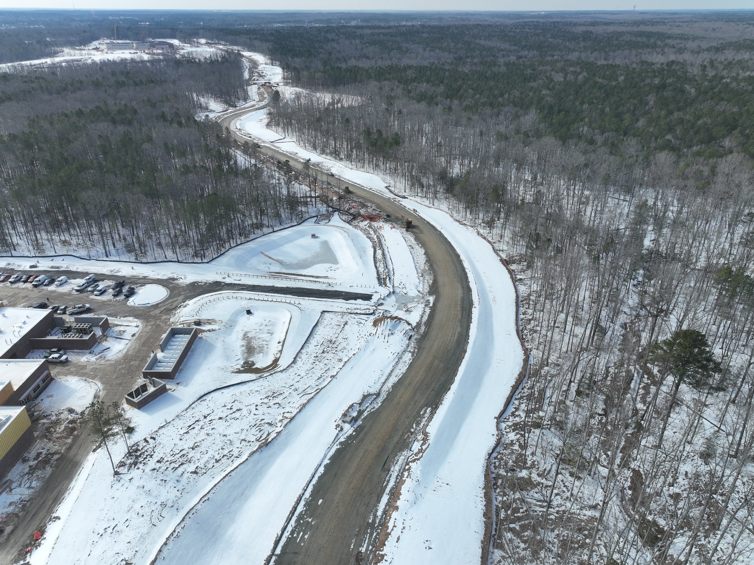 Roadway, pipe, and bridge work continues.