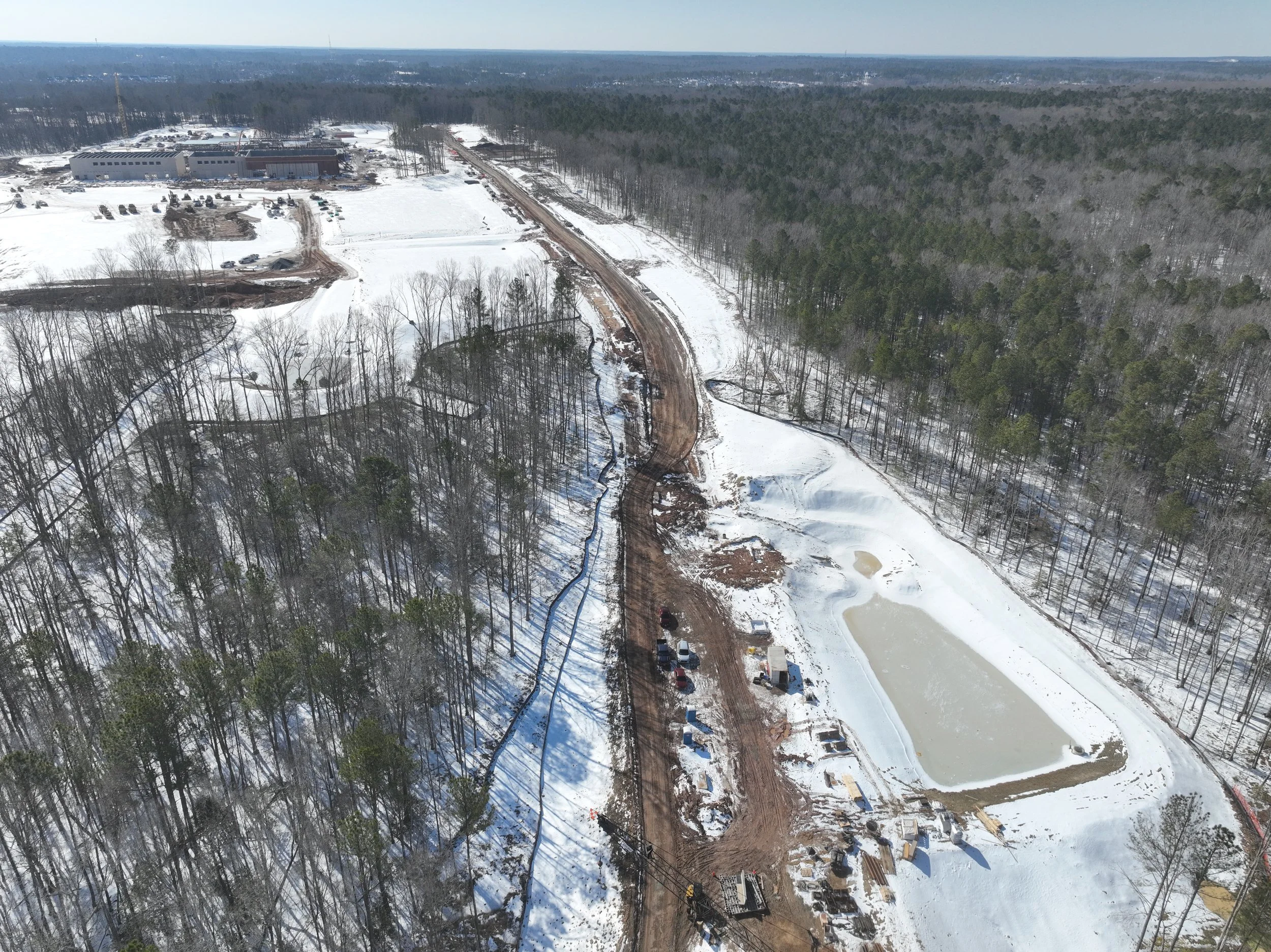 Roadway, pipe, and bridge work continues.