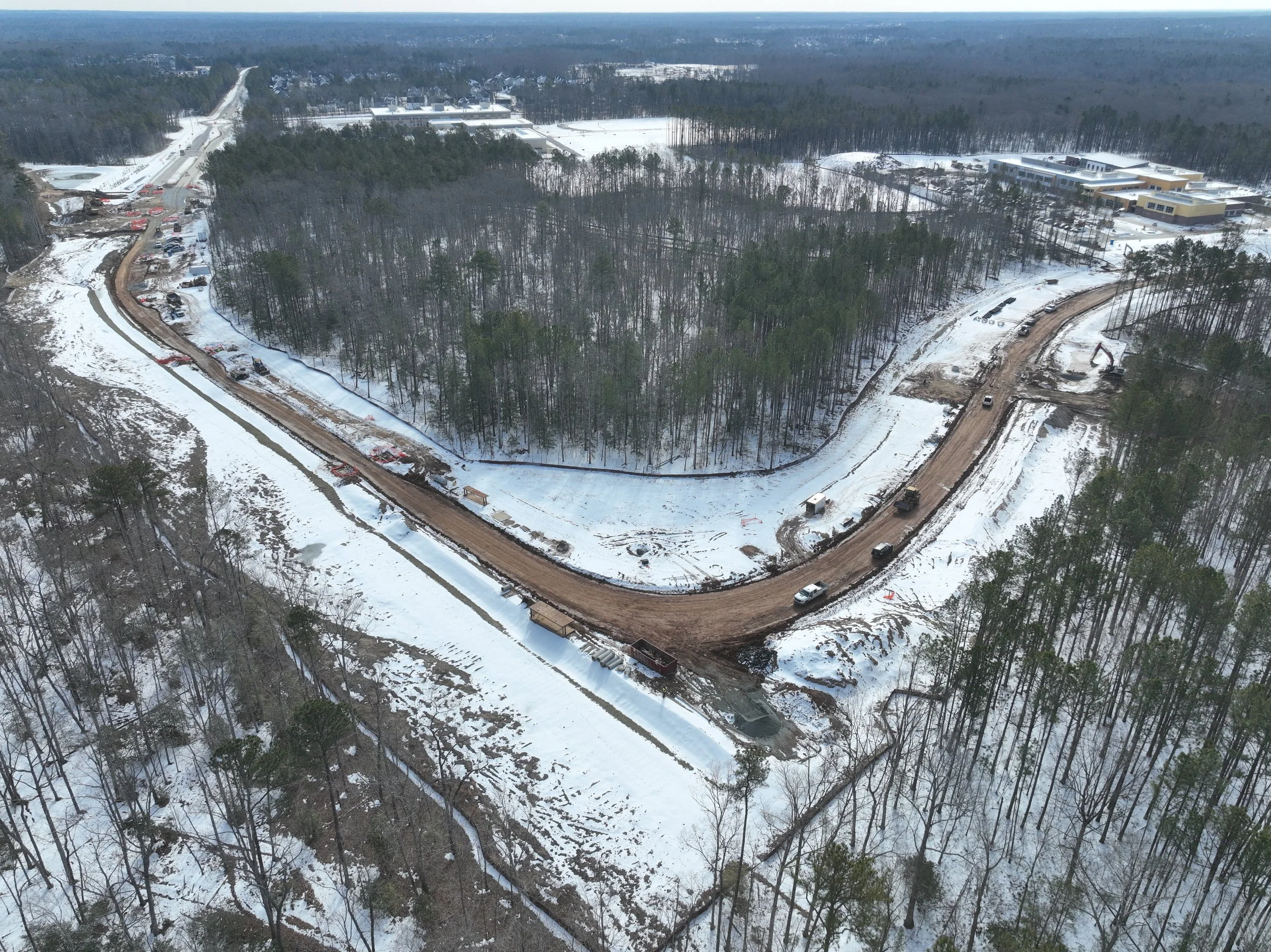 Roadway, pipe, and bridge work continues.