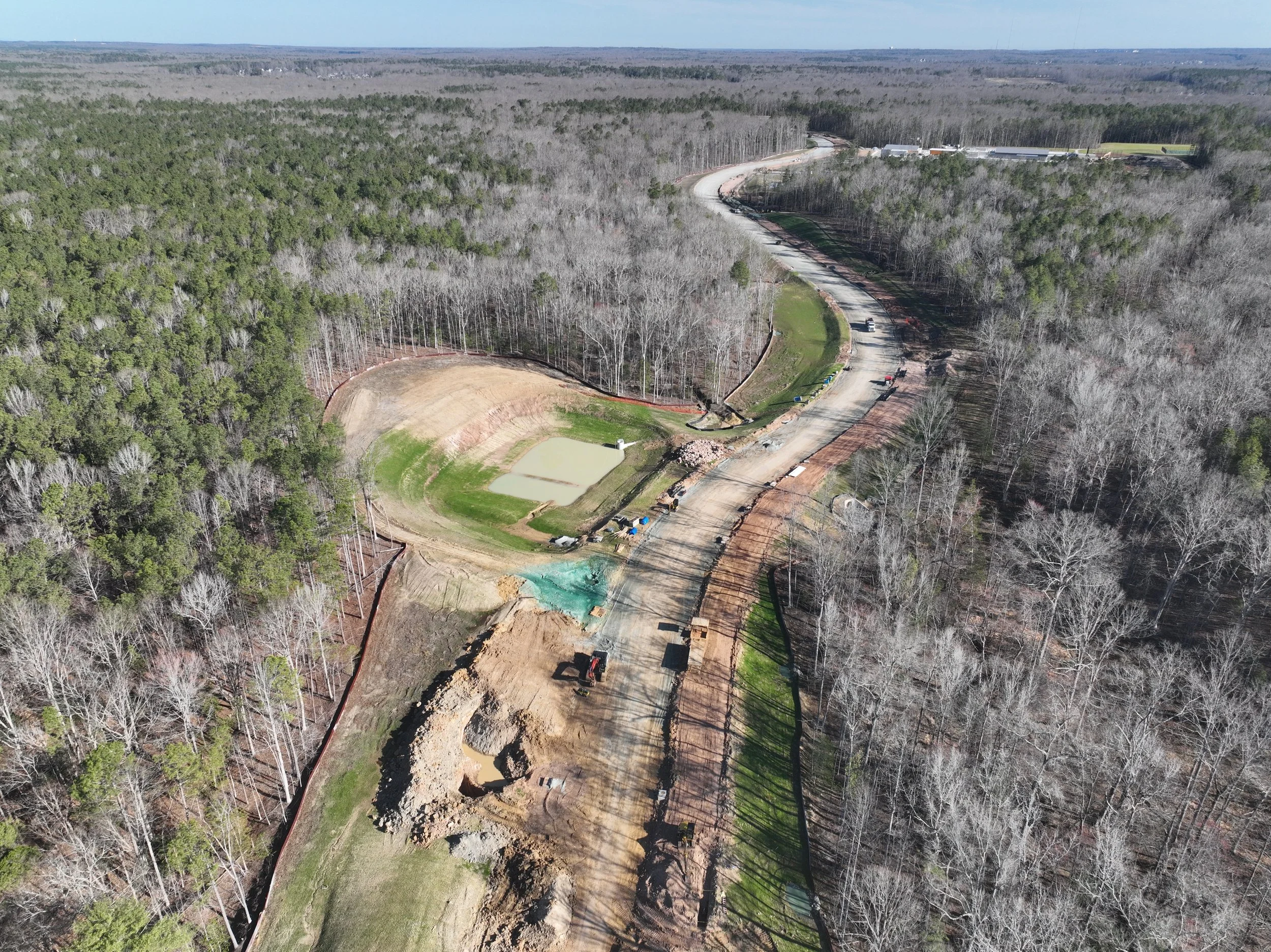 Pipe and bridge work continues. Subbase begins.