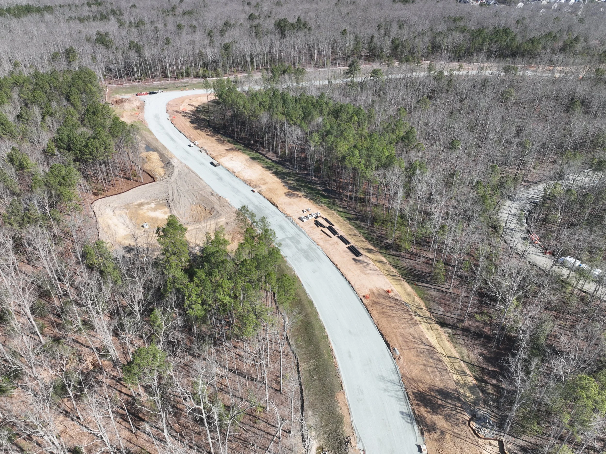 Pipe and bridge work continues. Subbase begins.