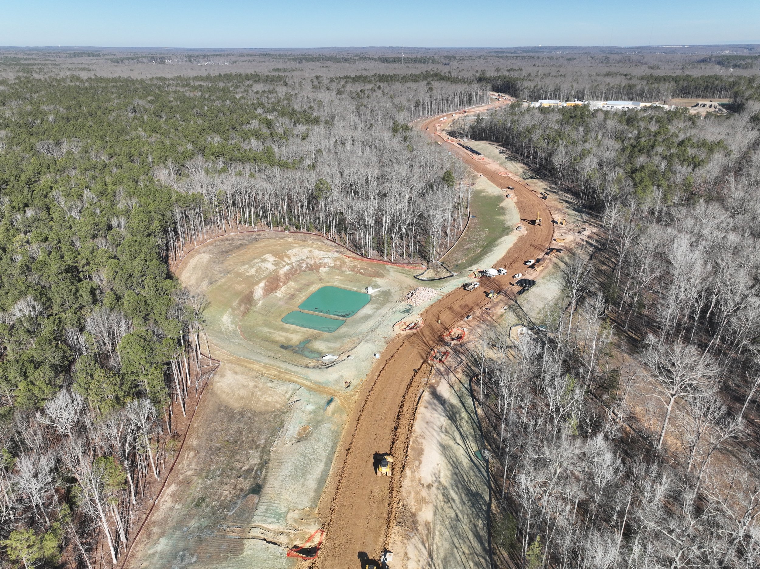 Roadway, waterline, and bridge work continues.