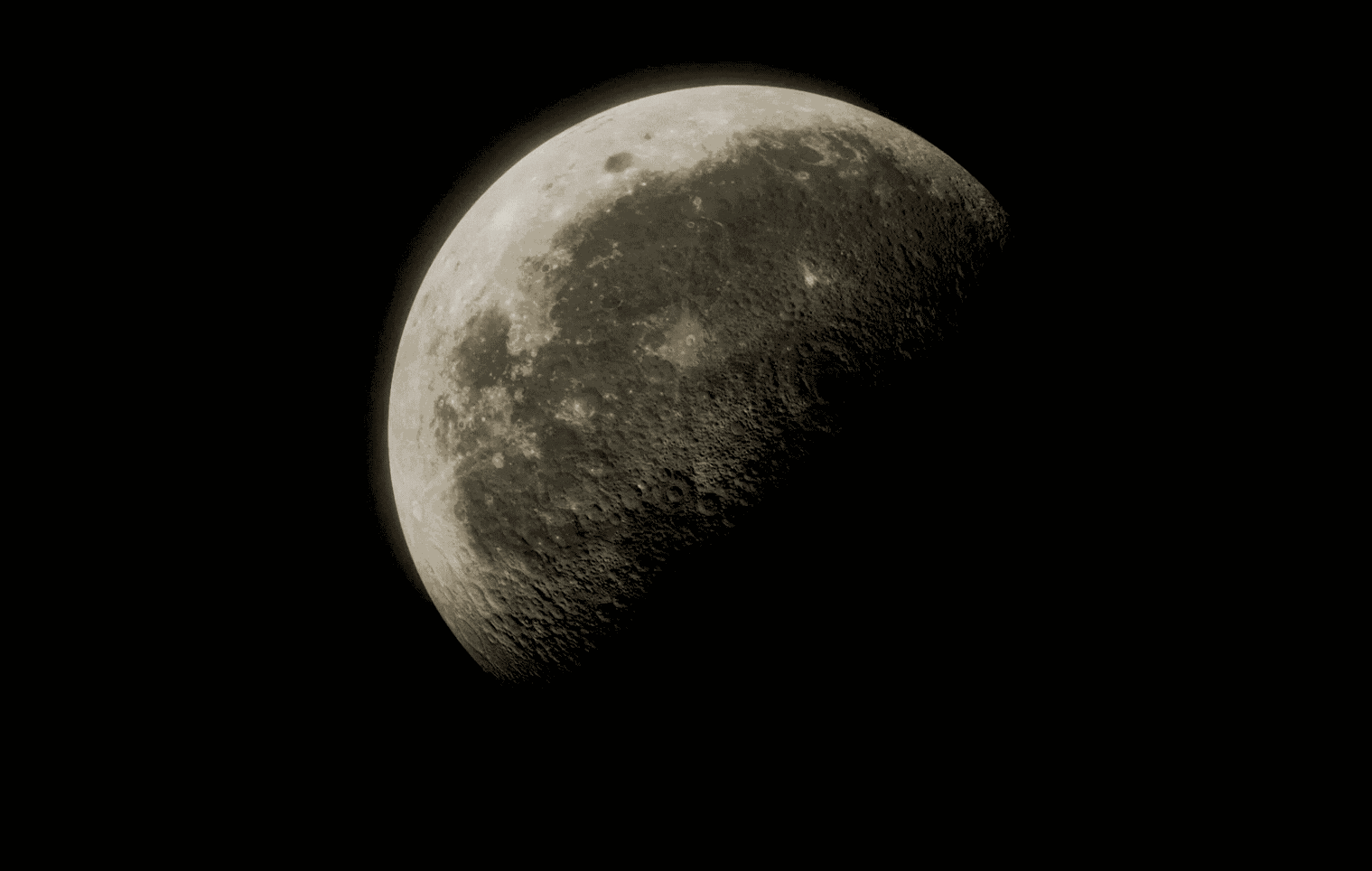 Close-up of the moon showing detailed surface features against a black space background.