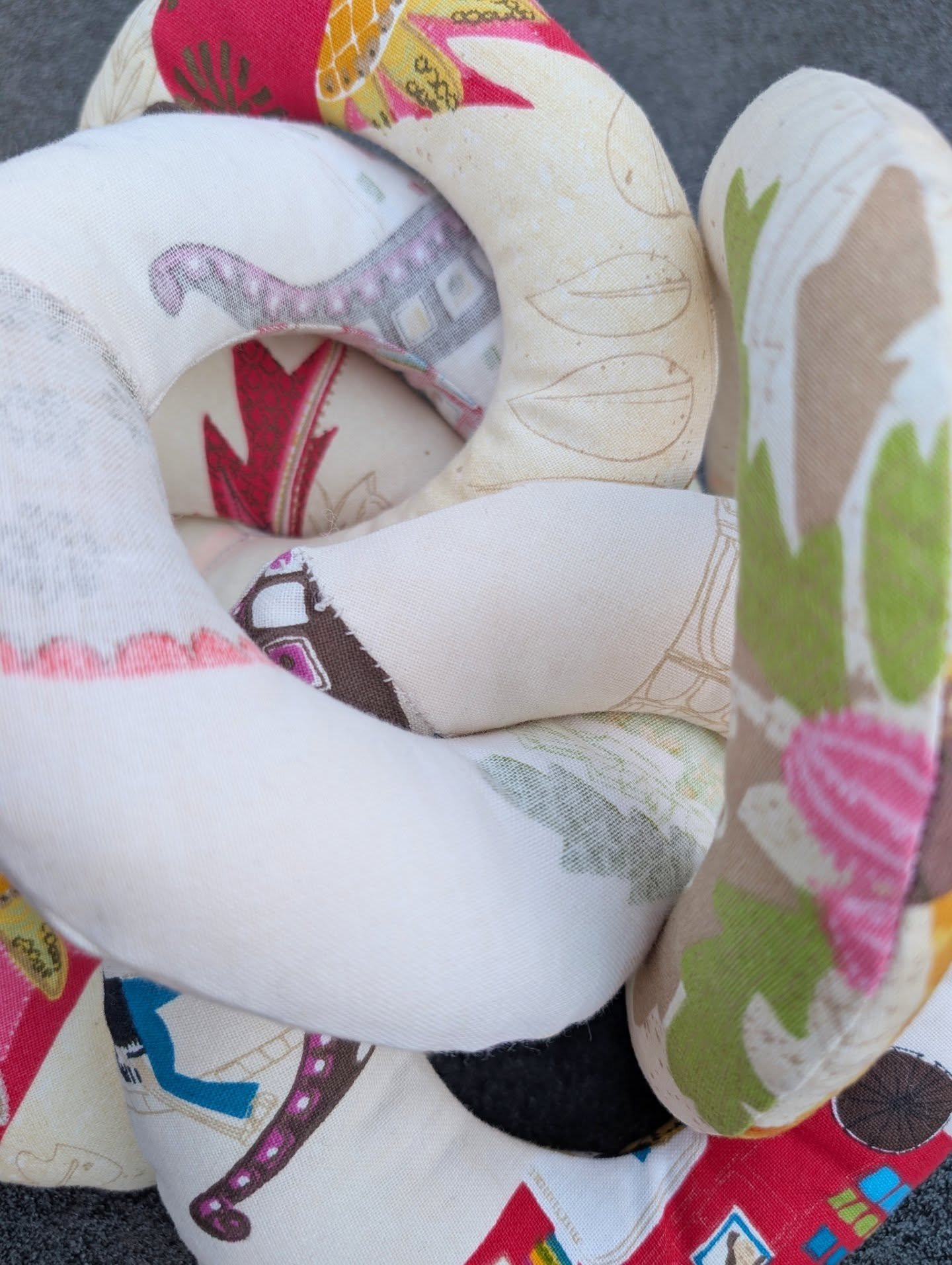 Finally got around to doing some sewing after all of the crochet pieces I've been working on 🧶

These chain links are machine and hand sewn, using second hand fabrics from my box of &quot;childish&quot; prints. I dreamt up a random idea for a piece 