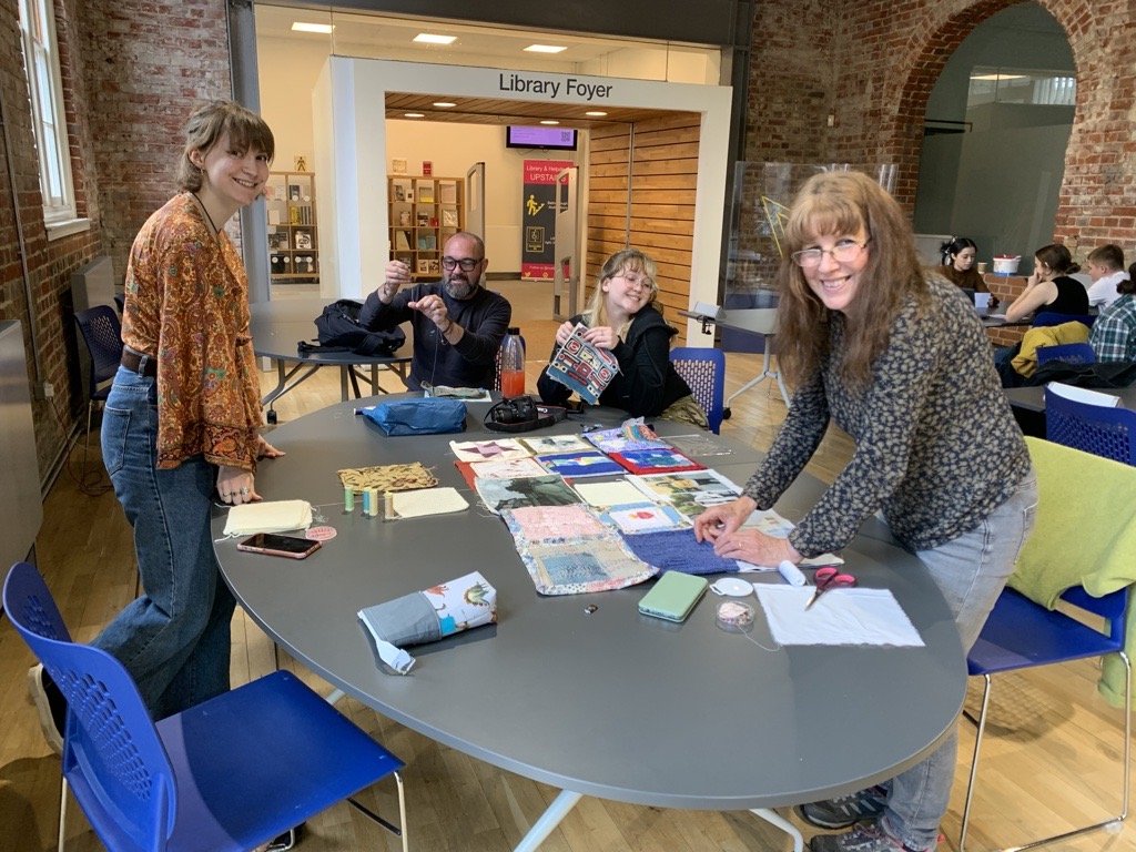 Workshop lead by Ruby to finish attaching the Quilt