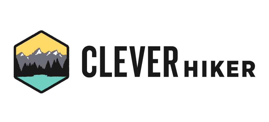 Logo for Clever Hiker featuring a mountain landscape with trees, a lake, and mountains in a stylized patch shape.