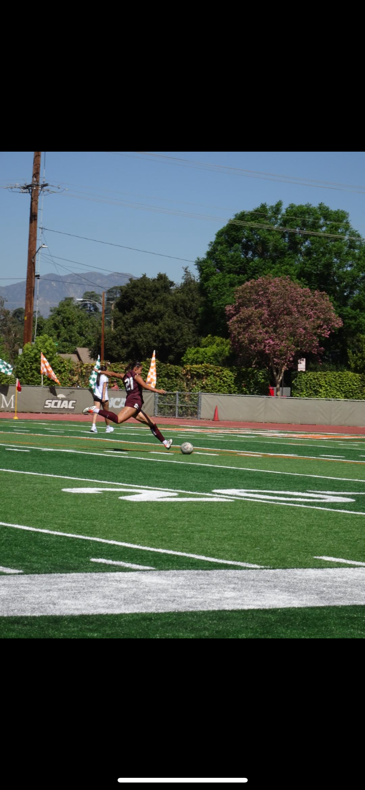 Coach Issa playing for her team