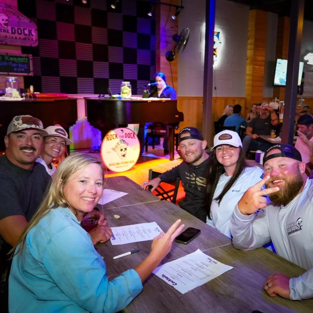 Guests enjoying a live dueling piano performance at Rock the Dock in downtown Morehead City North Carolina