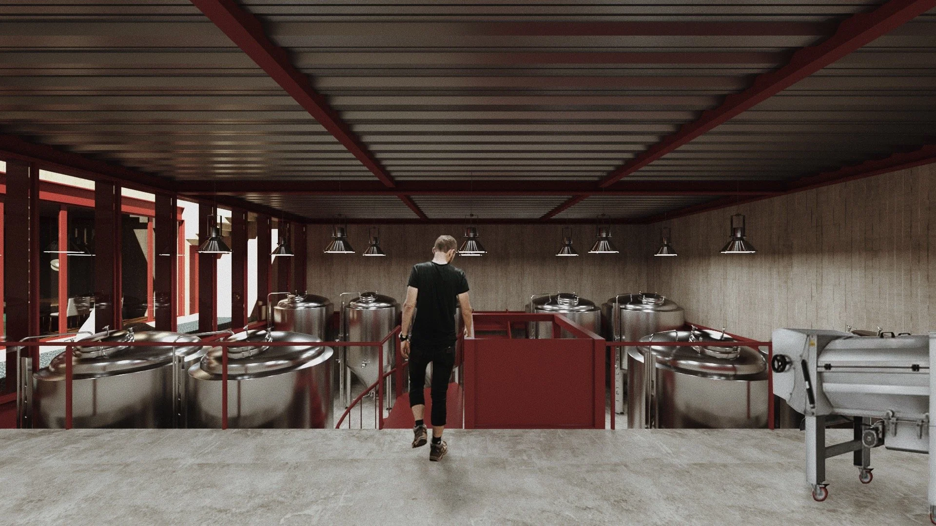 Joven caminando en un área de cervecería industrial con tanques de fermentación de acero inoxidable y equipo de fabricación de cerveza.
