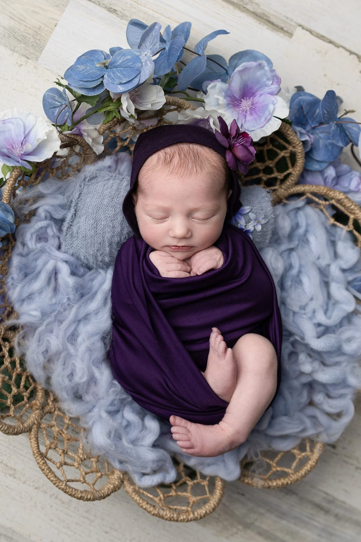Wrapped newborn pose photographed by Detroit Michigan newborn photographer.