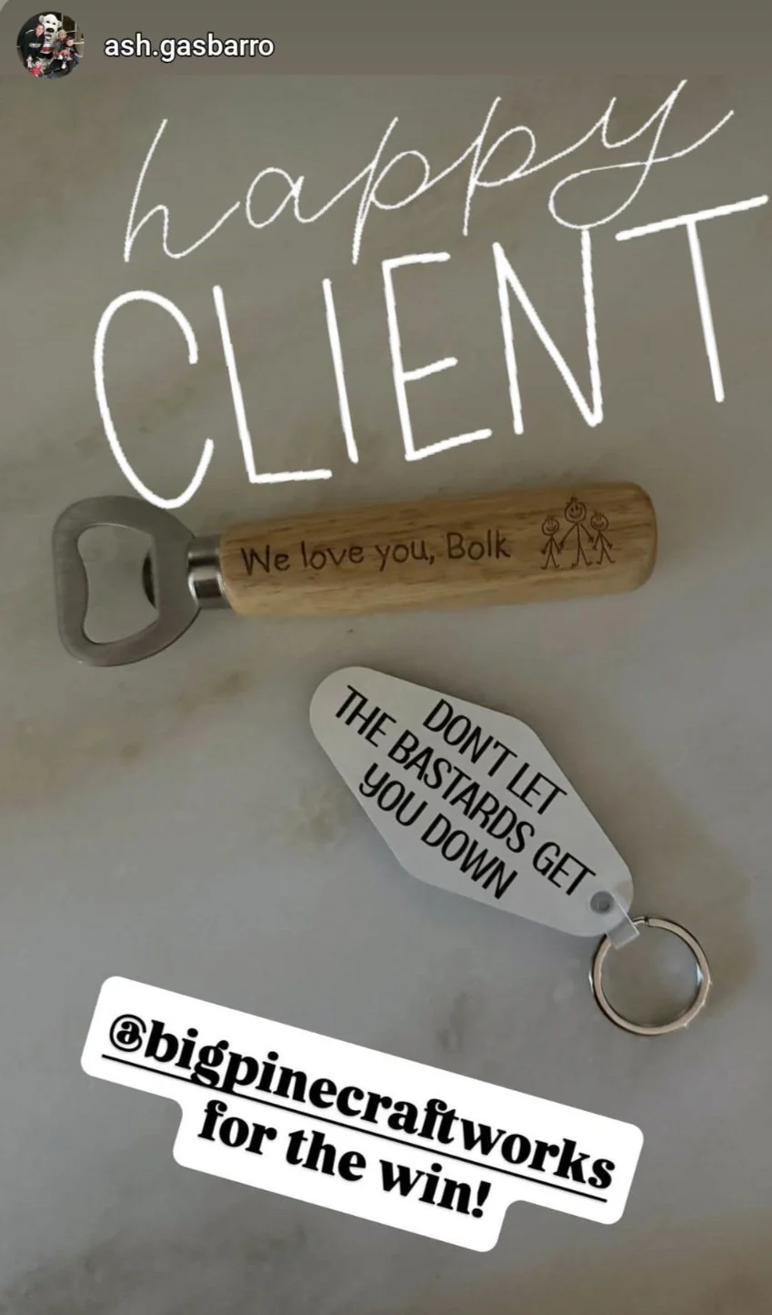 A bottle opener with the message, "We love you, Bolk," a keychain with a quote, "DONT LET THE BASTARDS GET YOU DOWN," and handwritten text saying "happy CLIENT."