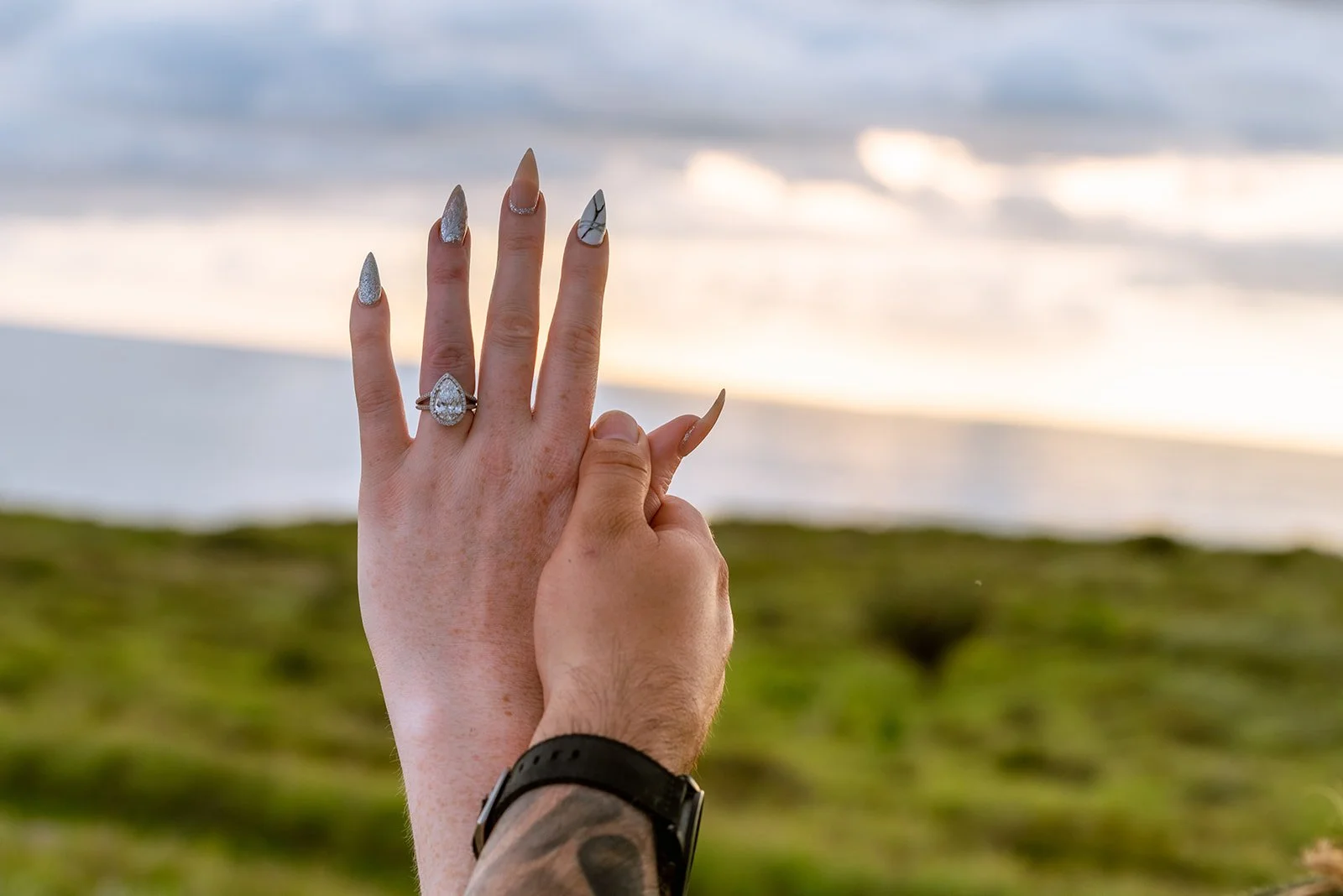 Newly engaged couple showing the engagement ring at Faro Los Morrillos in Cabo Rojo, Puerto Rico.