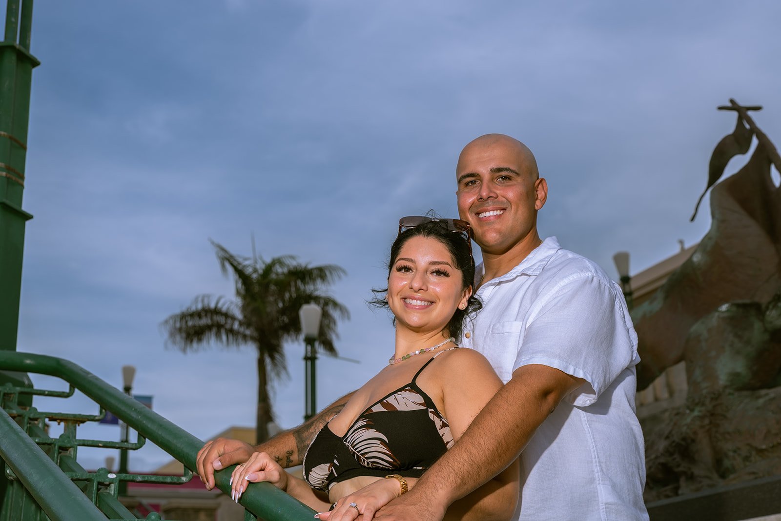 A couple smiles under the sunset sky in Old San Juan