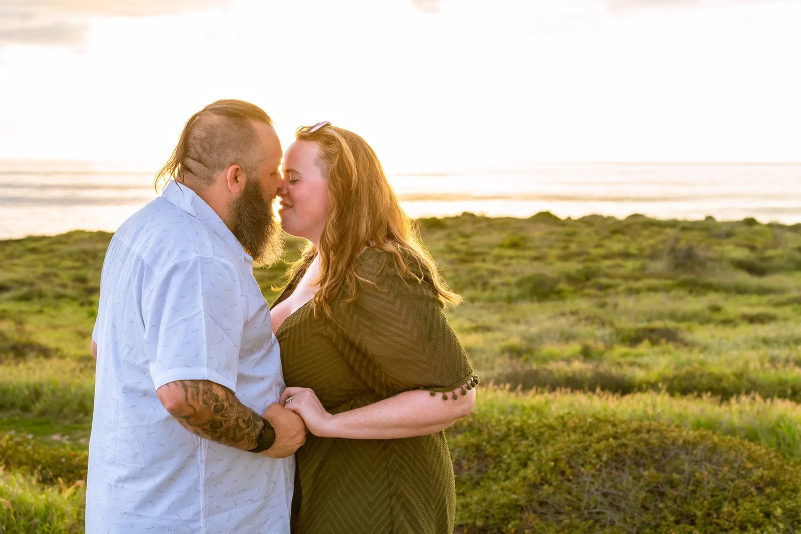 A couple is about to kiss during golden hour in Cabo Rojo, Puerto Rico