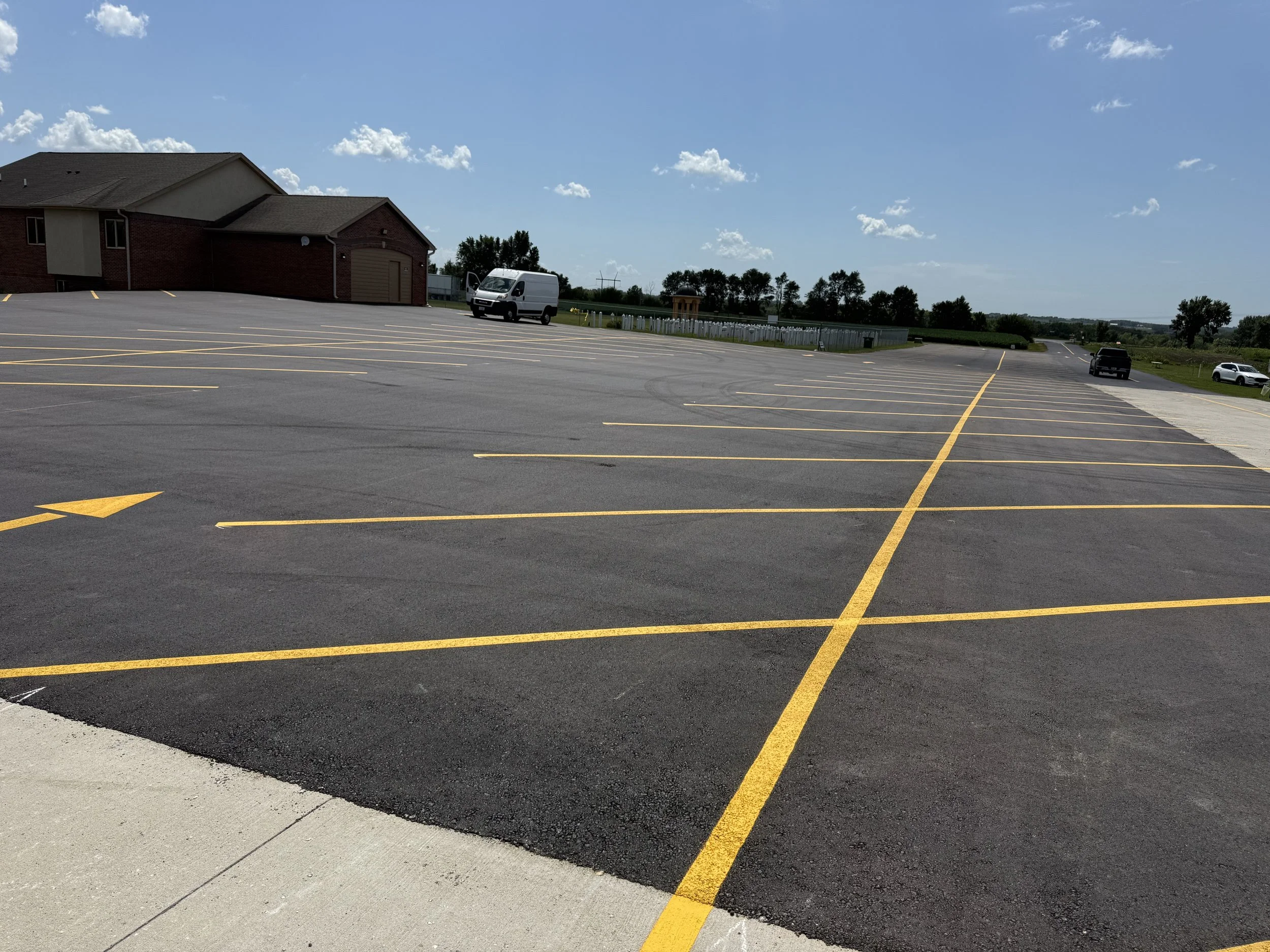 Extensive commercial development parking lot with professional, uniform line striping for maximum capacity.
