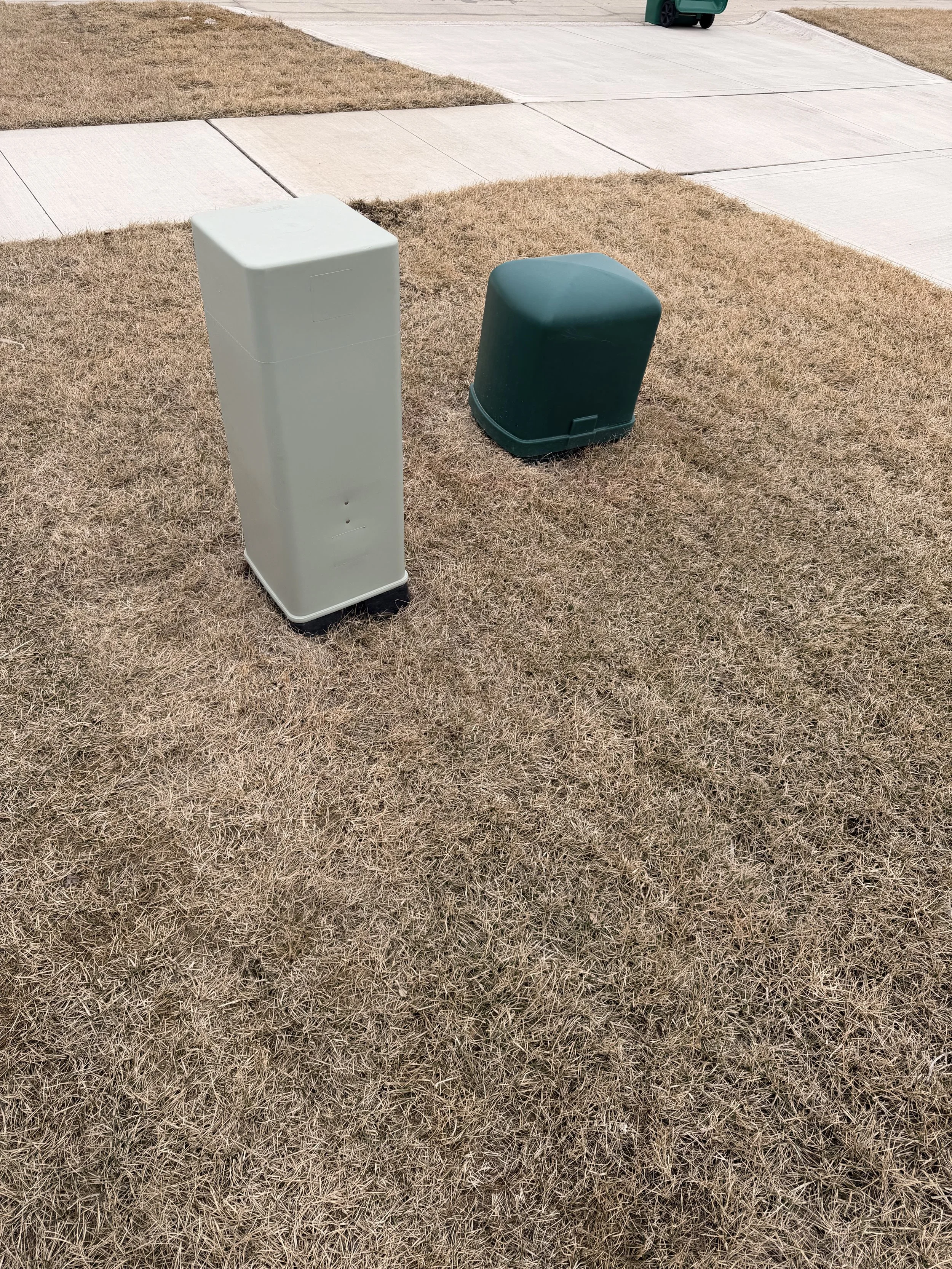 Careful site evaluation and grading around residential utility boxes to ensure proper water runoff.